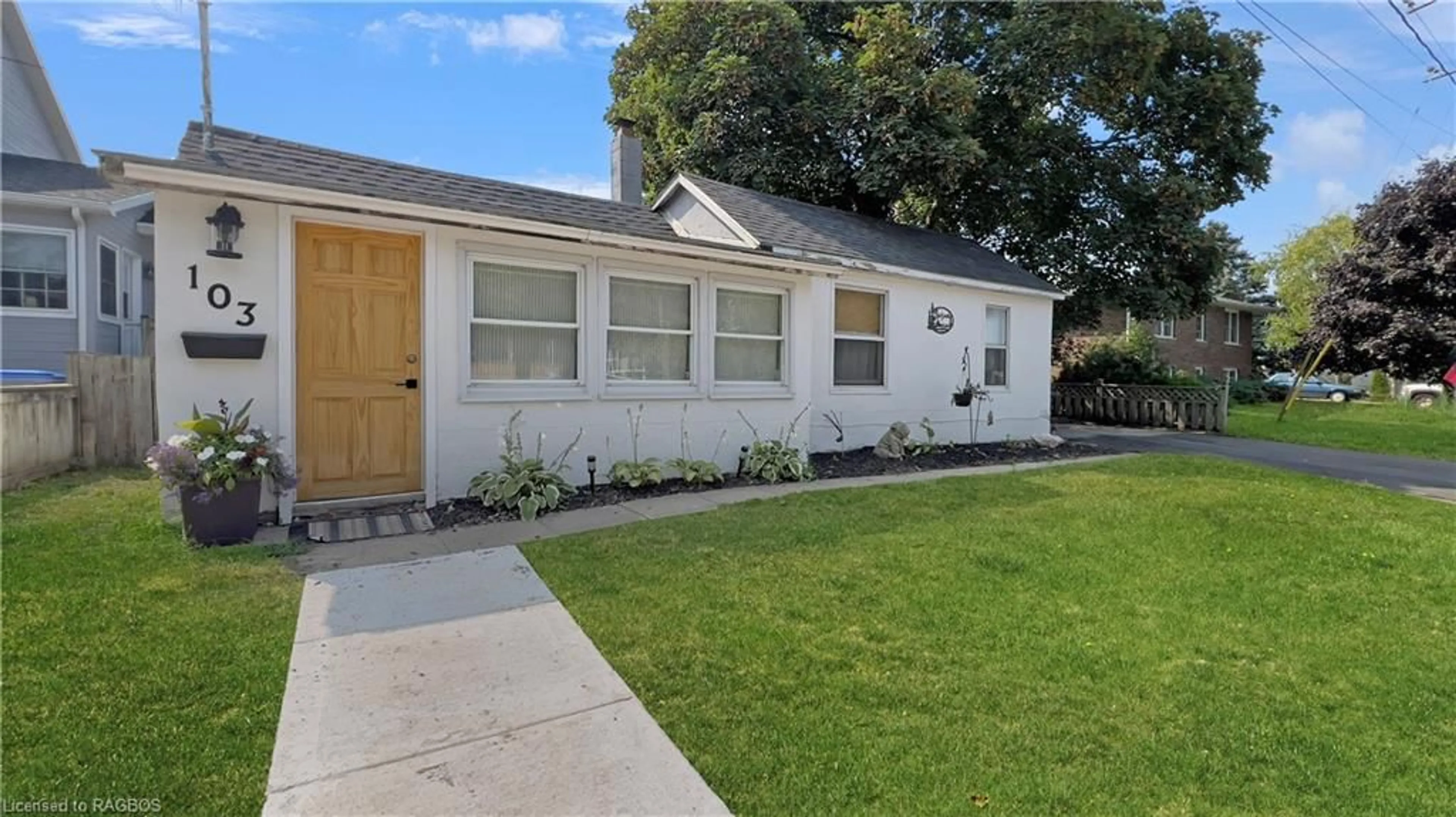 Frontside or backside of a home, the fenced backyard for 103 Albert St, Goderich Ontario N7A 2N6