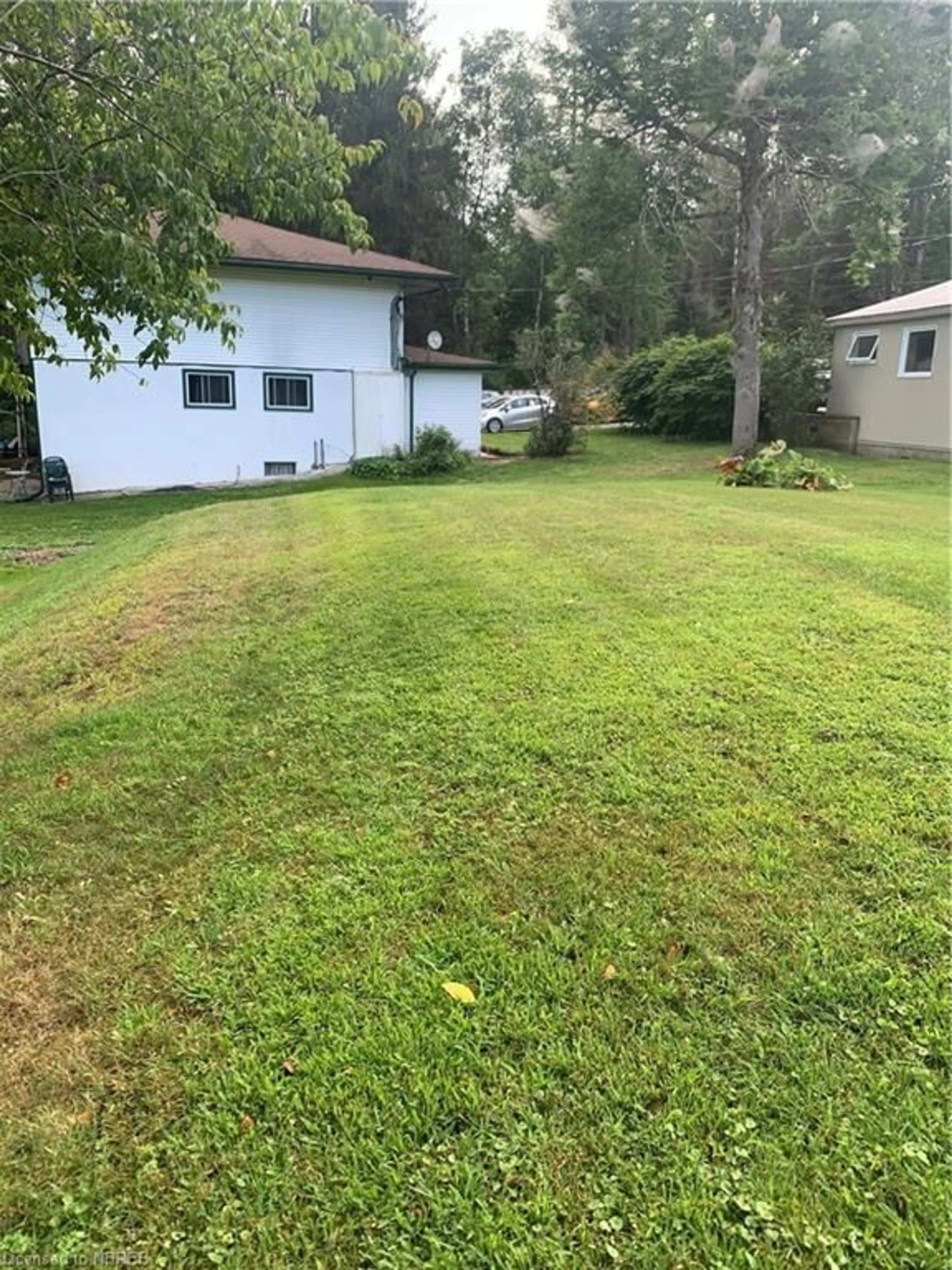 Frontside or backside of a home, the fenced backyard for 118 Dugas Rd, Corbeil Ontario P0H 1K0