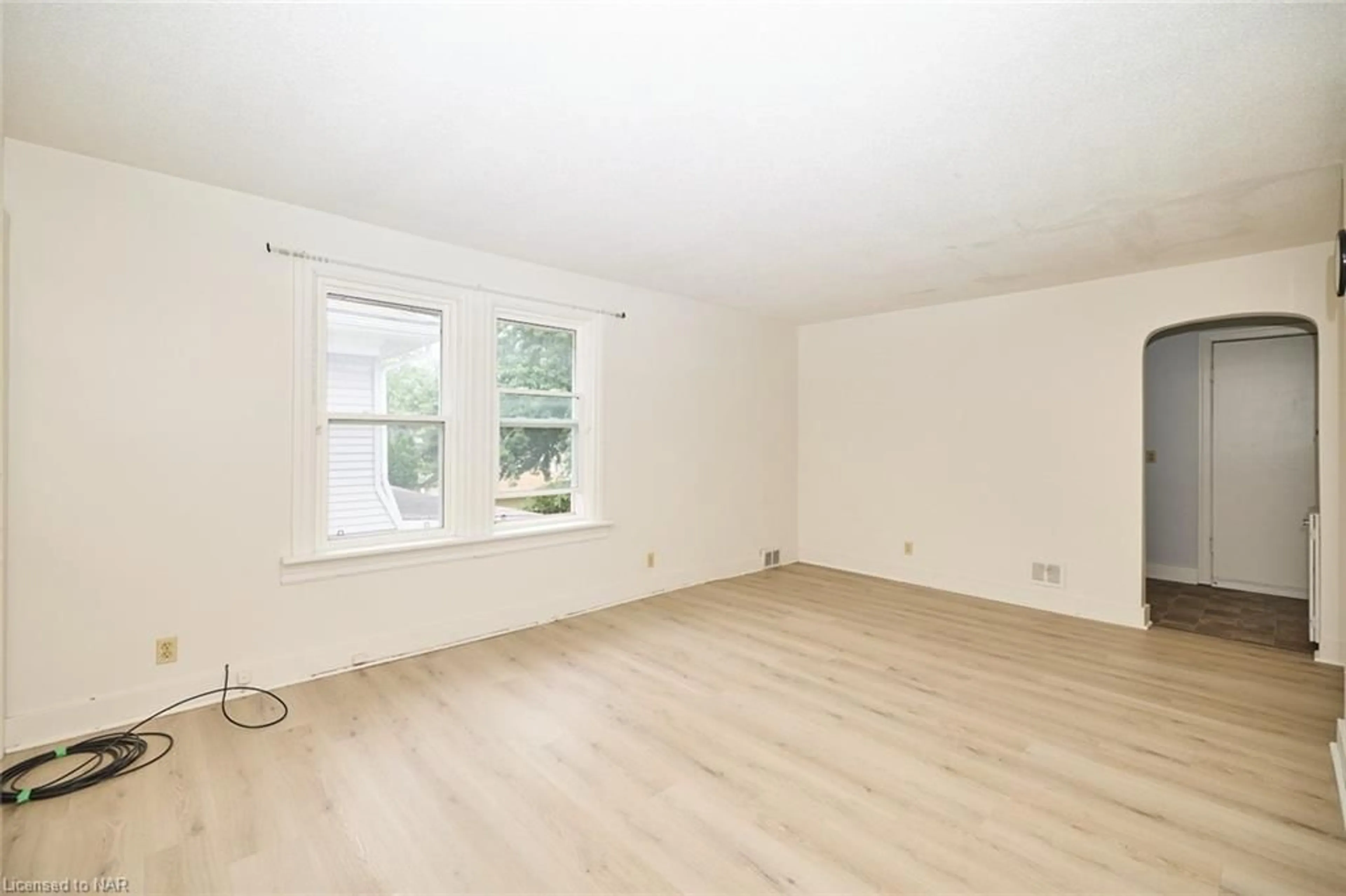 A pic of a room, wood floors for 4889-4891 Mcrae St, Niagara Falls Ontario L2E 1N9