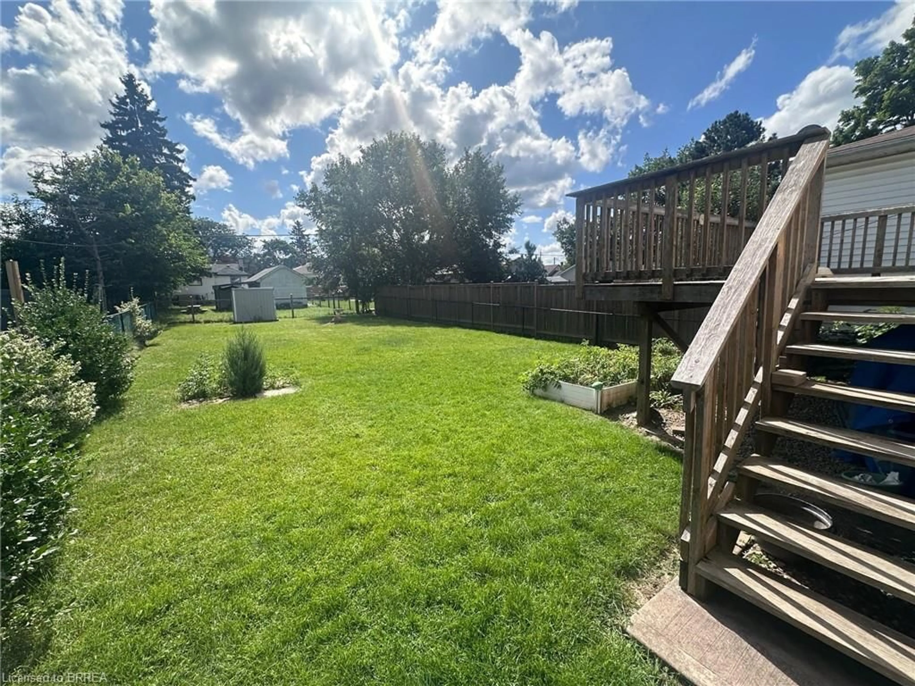 Frontside or backside of a home, the fenced backyard for 201 Grand St, Brantford Ontario N3R 4C2