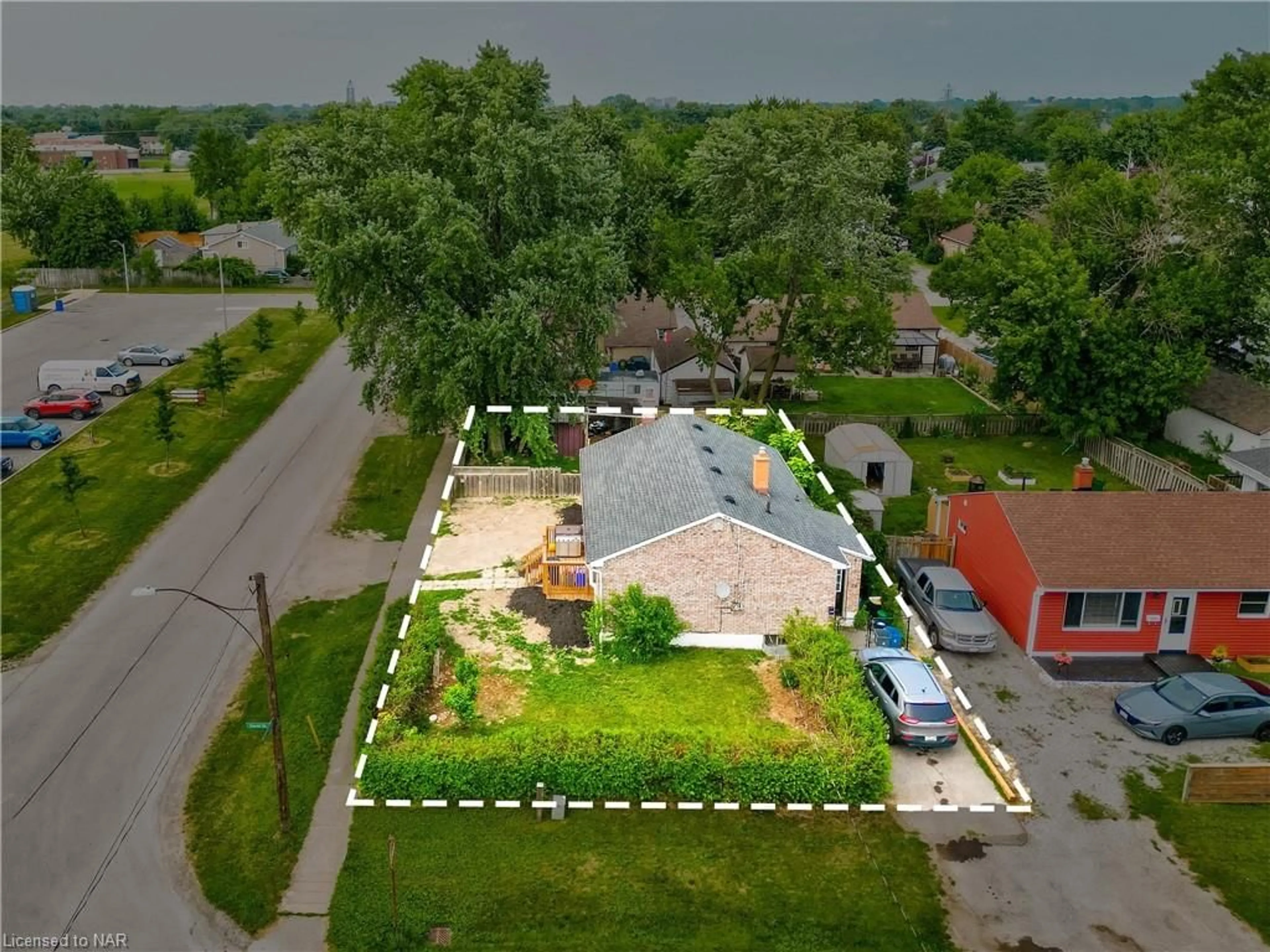 Frontside or backside of a home, the fenced backyard for 79 Powerview Ave, St. Catharines Ontario L2S 1W5