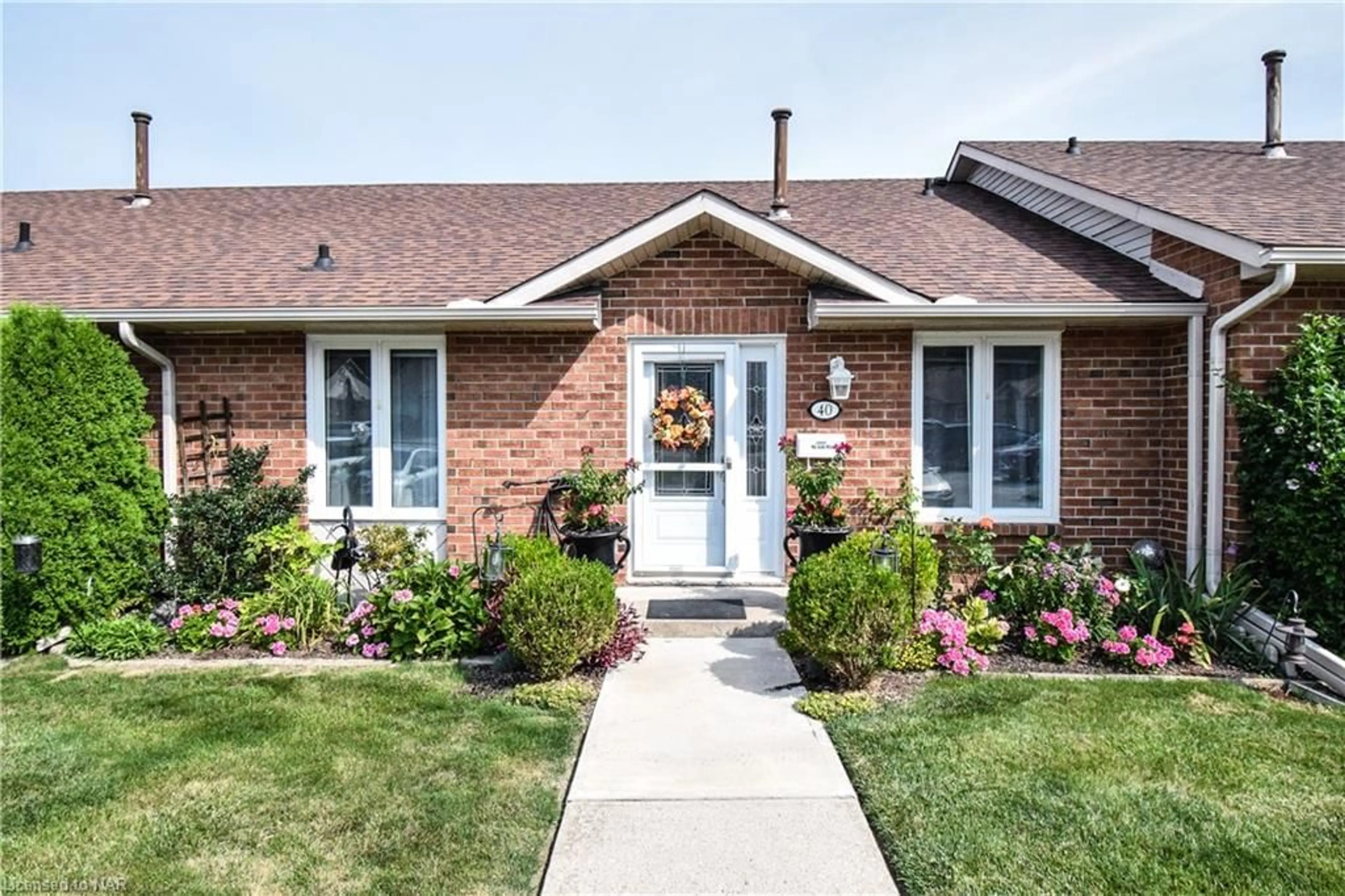 Home with brick exterior material for 122 Bunting Rd #40, St. Catharines Ontario L2M 3X7