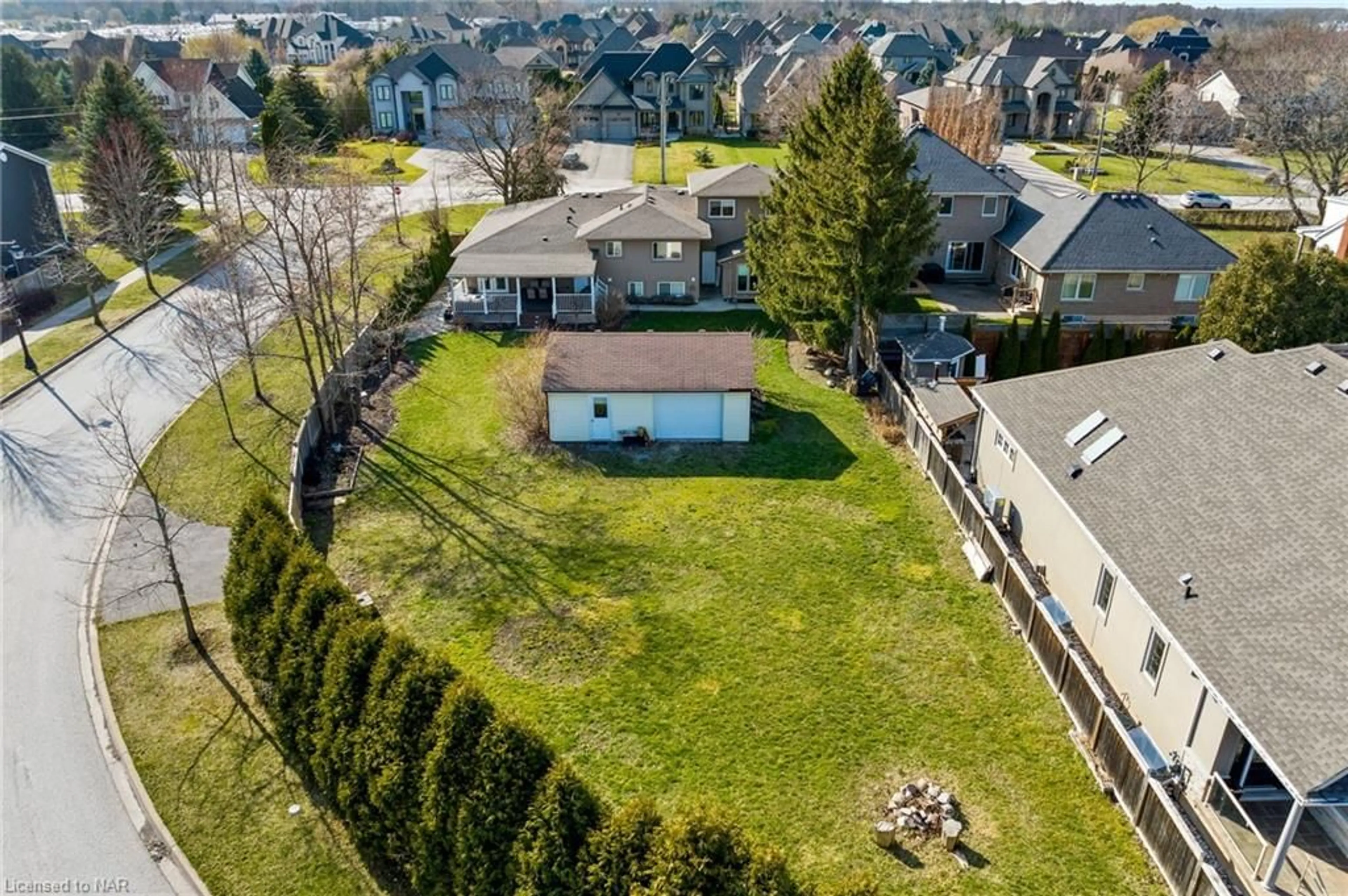 Frontside or backside of a home, the fenced backyard for 287 Tanbark Rd, Niagara-on-the-Lake Ontario L0S 1P0