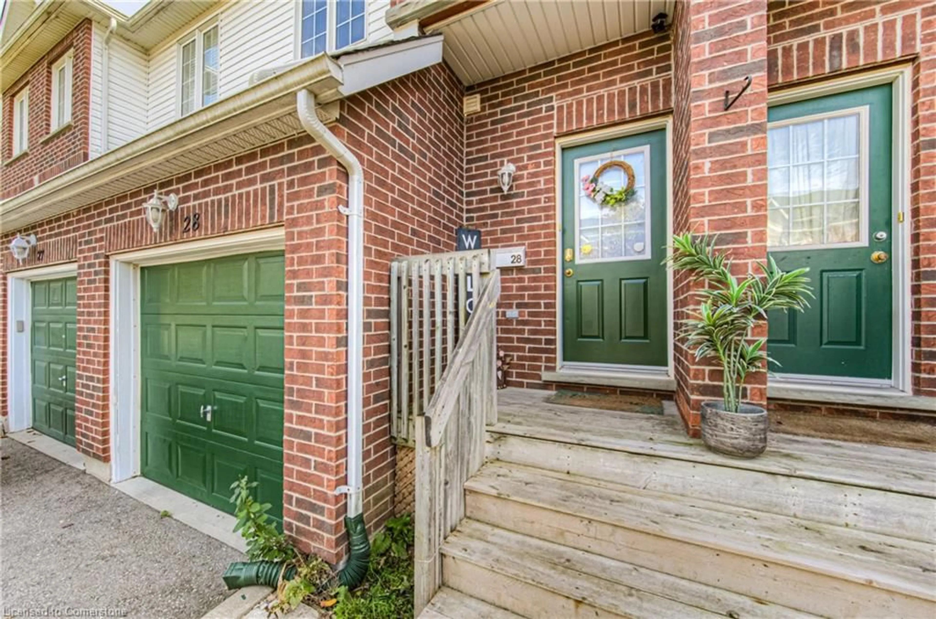 Home with brick exterior material, street for 42 Green Valley Dr #28, Kitchener Ontario N2P 2C3