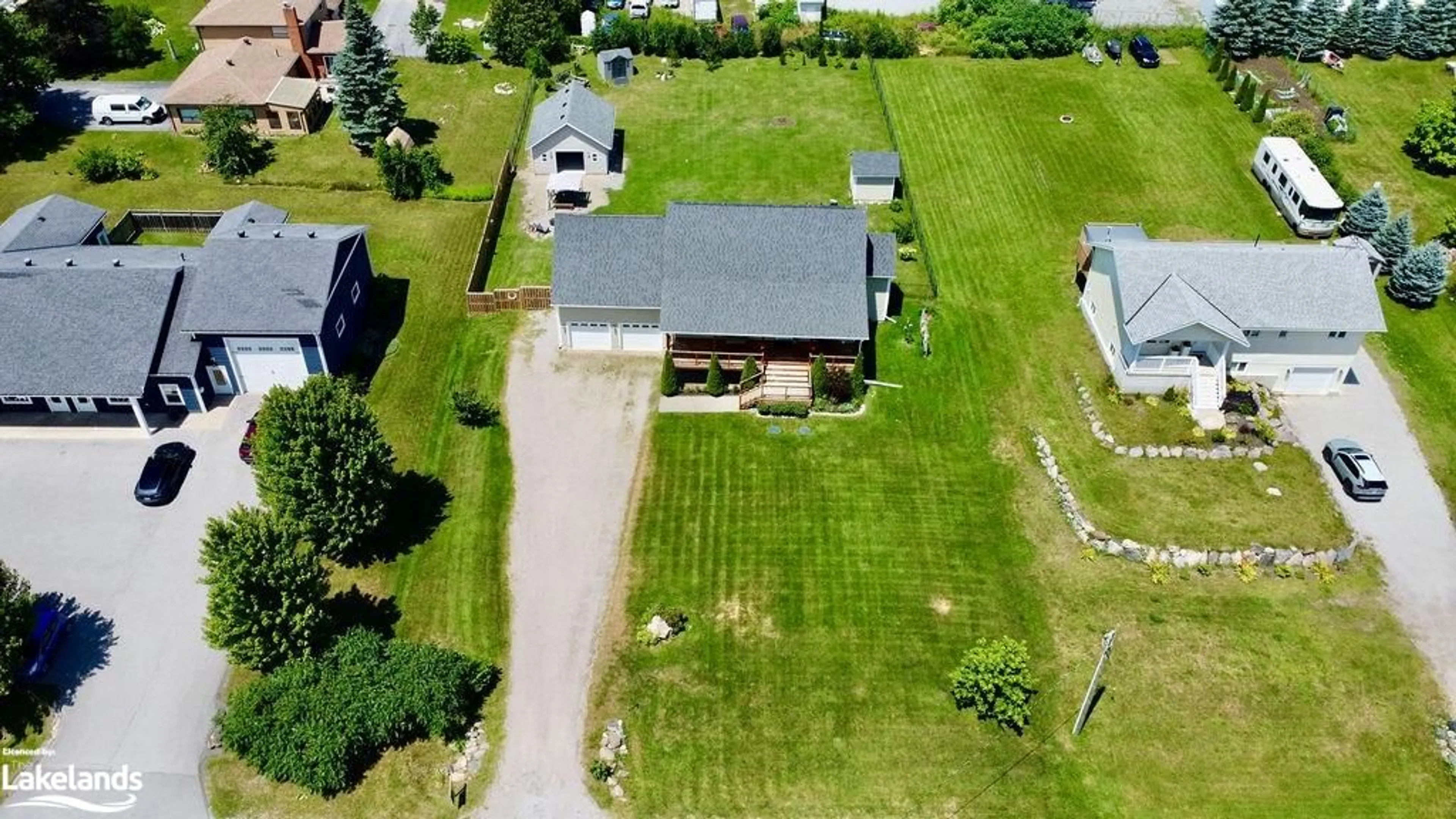 Frontside or backside of a home, the fenced backyard for 6 Concession Road 9 E, Tiny Ontario L0L 2J0