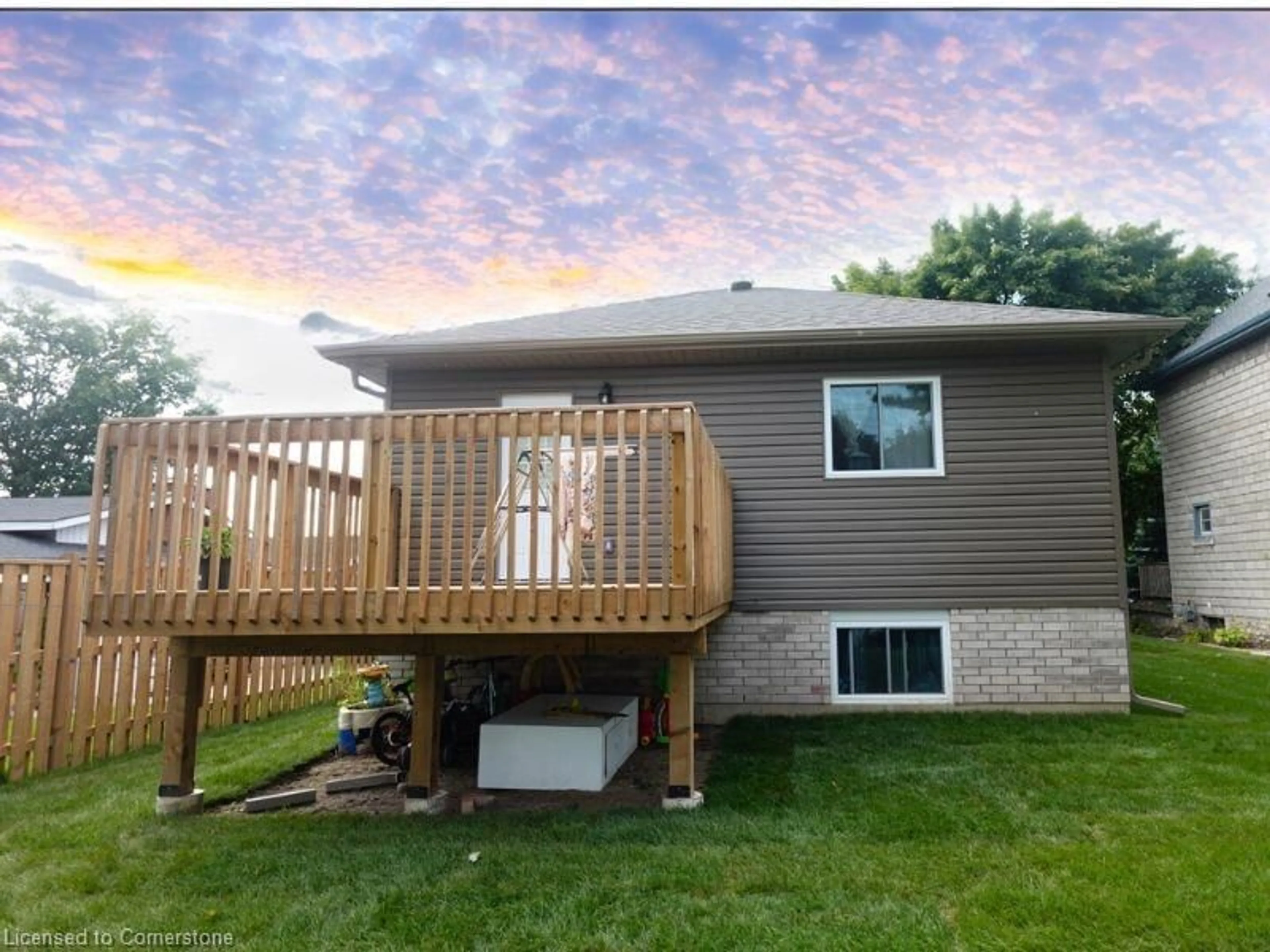 Frontside or backside of a home, the fenced backyard for 109 James St, St. Marys Ontario N3A 2P3