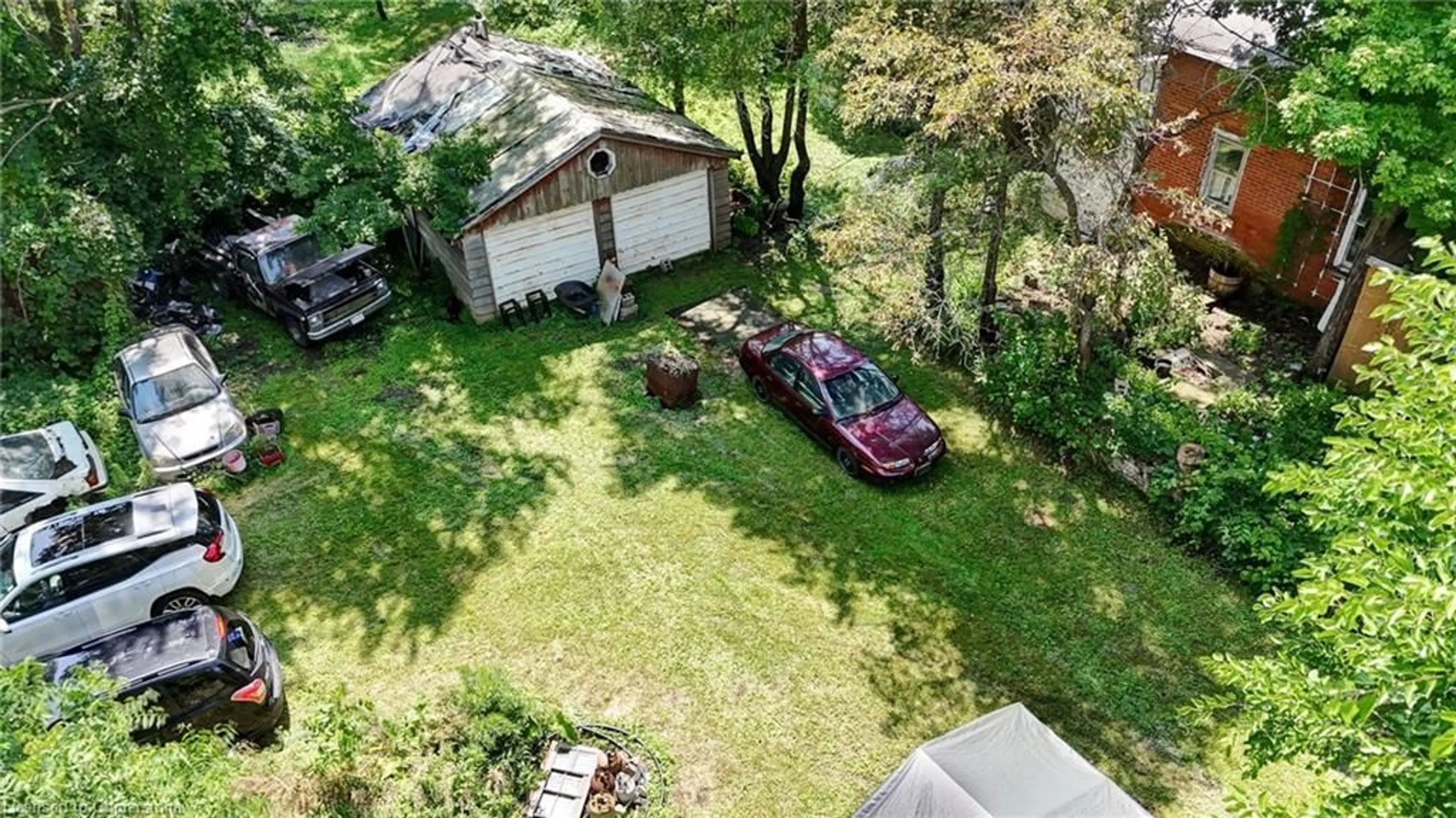 A pic from exterior of the house or condo, the fenced backyard for 631 8 Hwy, Dundas Ontario L9H 5E1