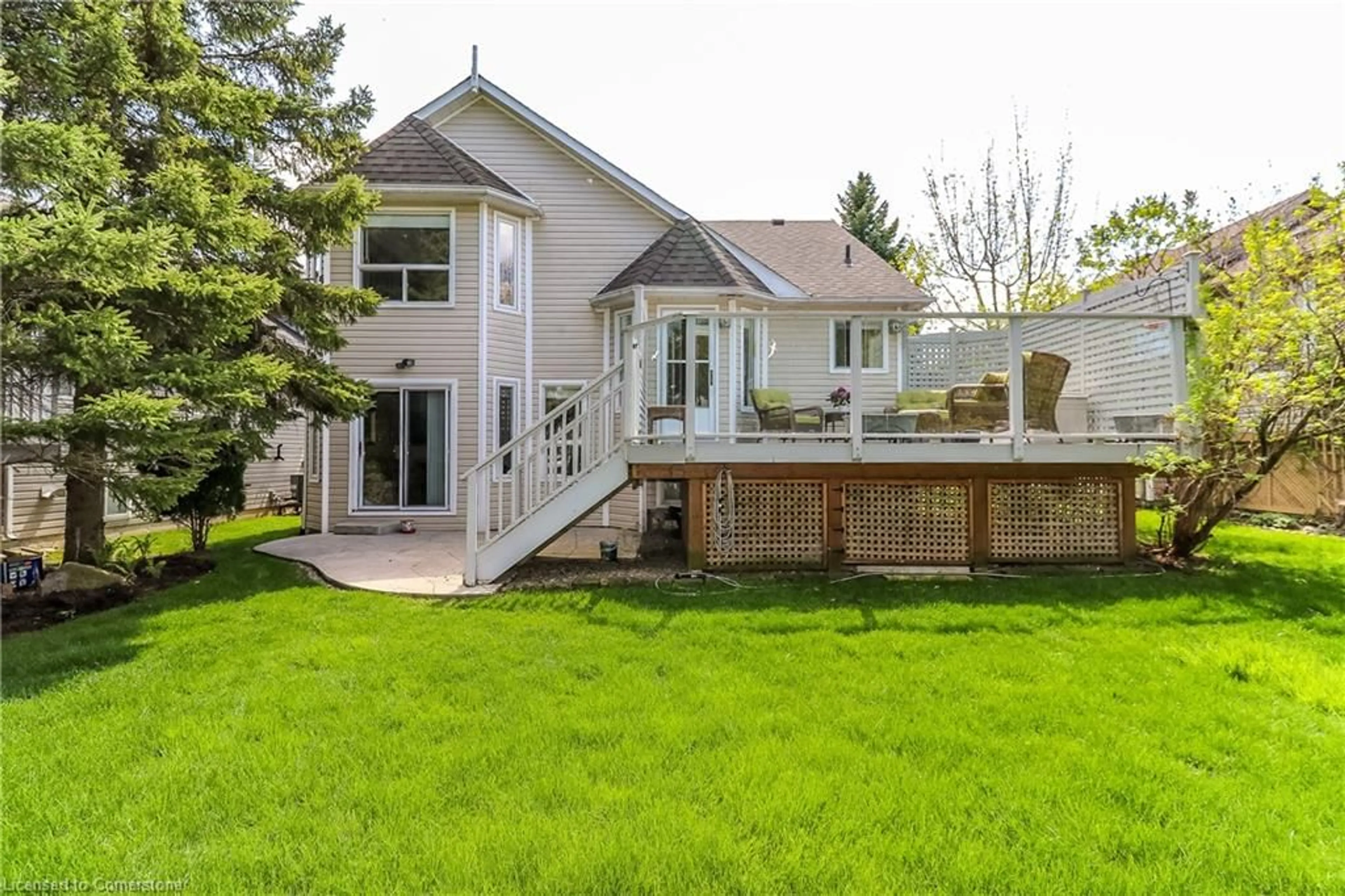 Frontside or backside of a home, the fenced backyard for 56 Trott Blvd, Collingwood Ontario L9Y 5B6