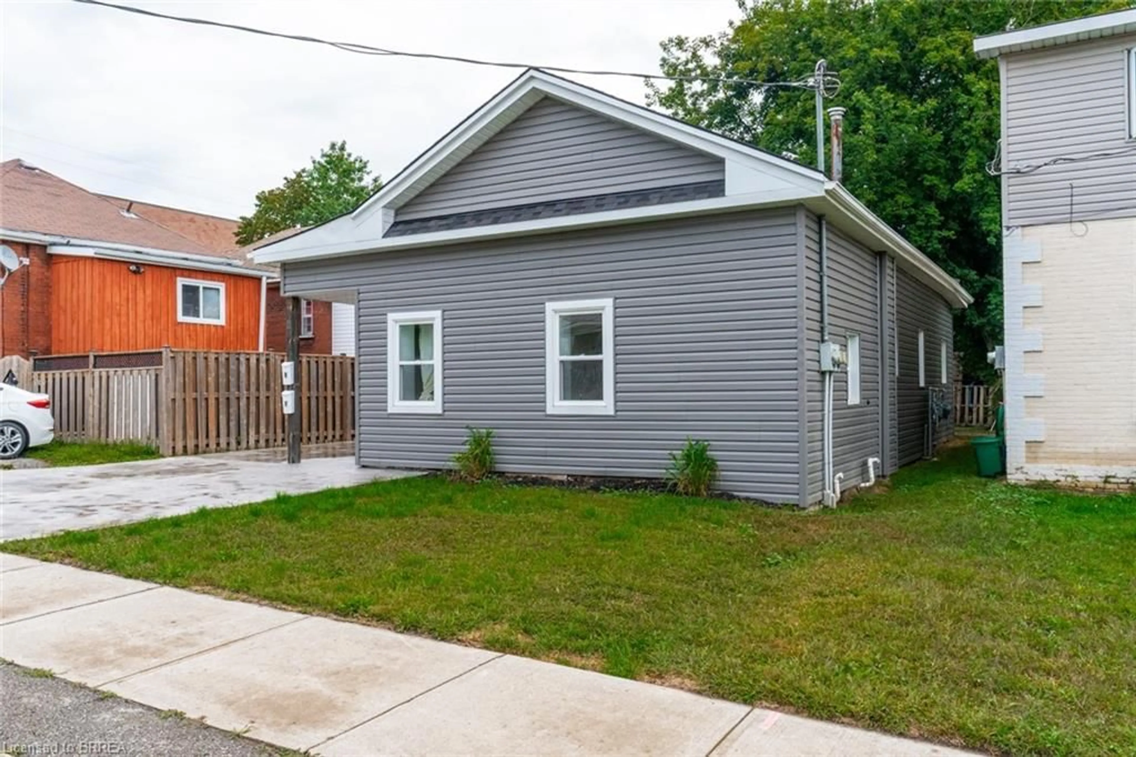 Frontside or backside of a home, the fenced backyard for 11 Washington St, Brantford Ontario N3R 3W9