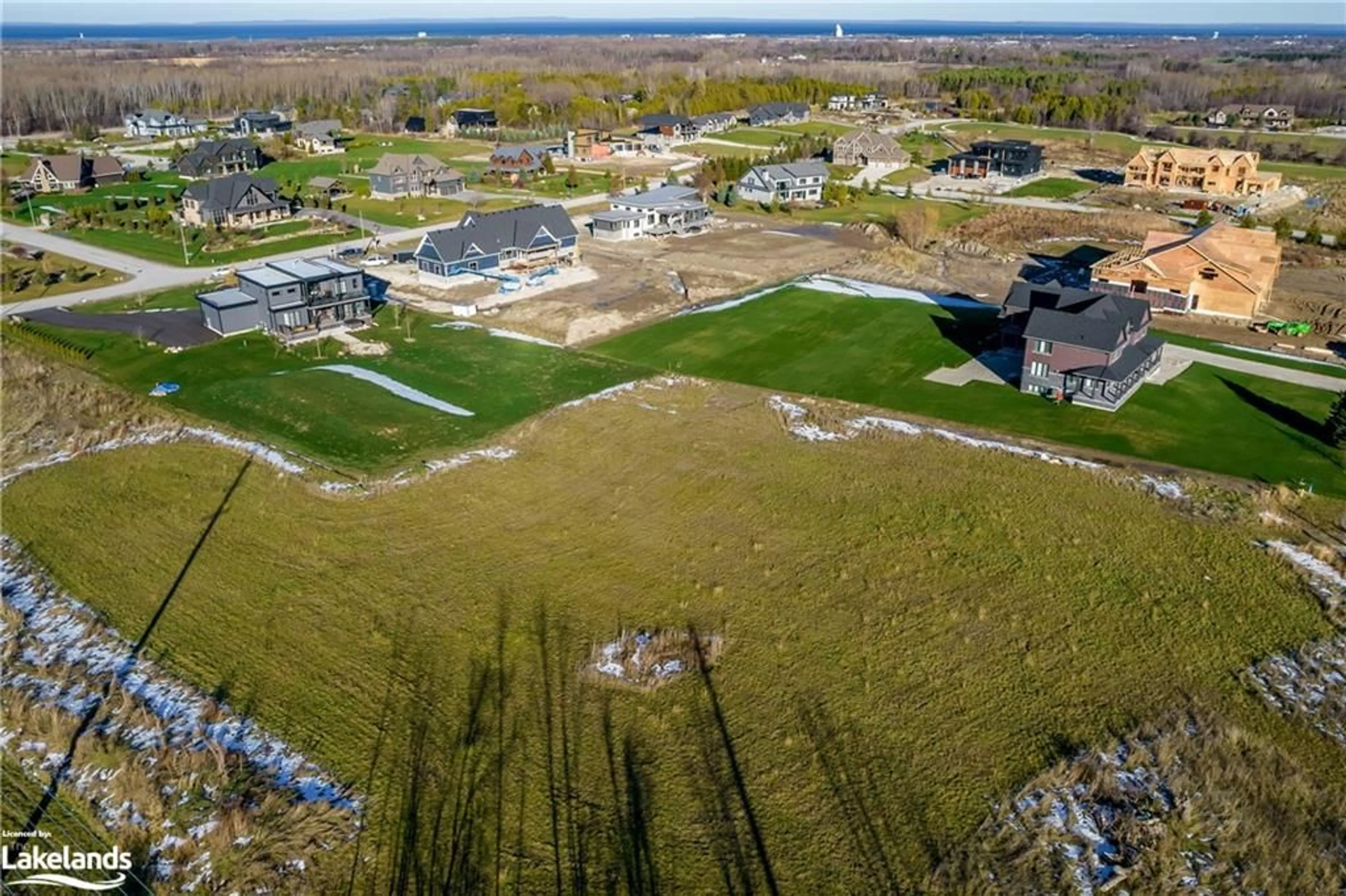 A pic from exterior of the house or condo, the fenced backyard for 19 Raintree Crt, Collingwood Ontario L9Y 0K2