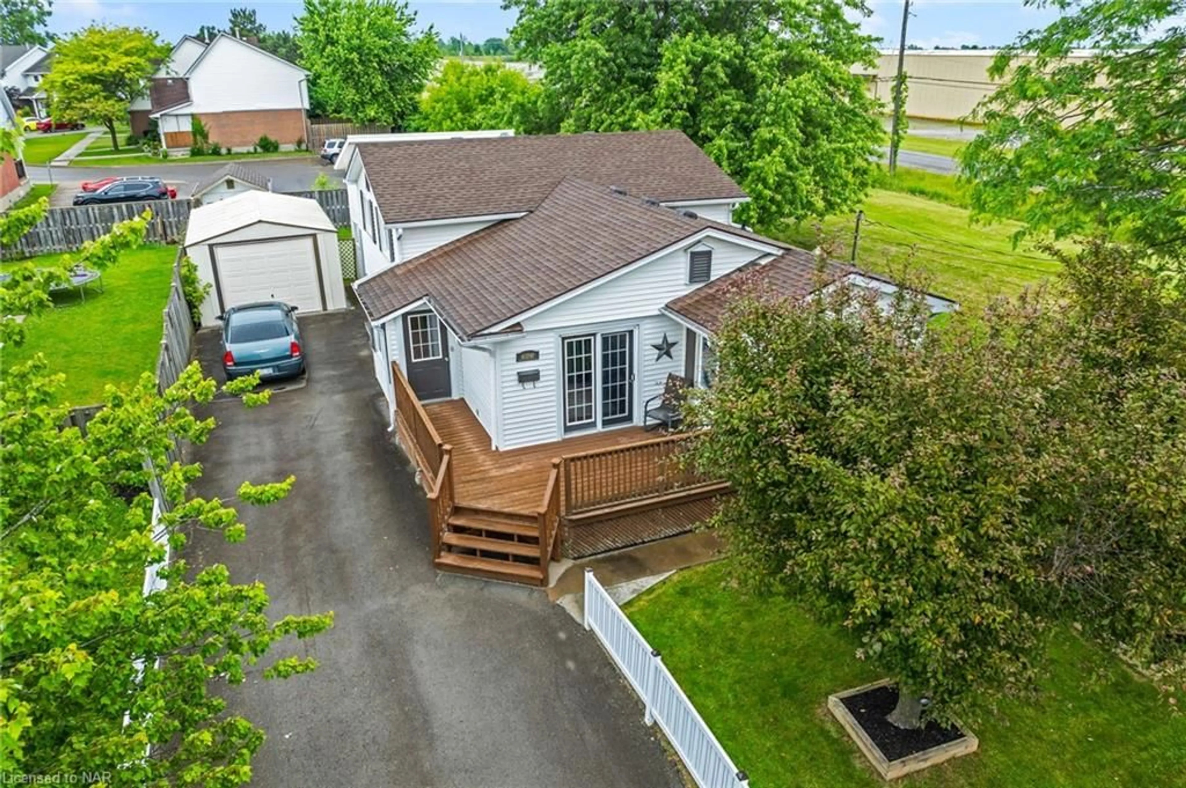 Frontside or backside of a home, the fenced backyard for 263 Barrick Rd, Port Colborne Ontario L3K 5Z6