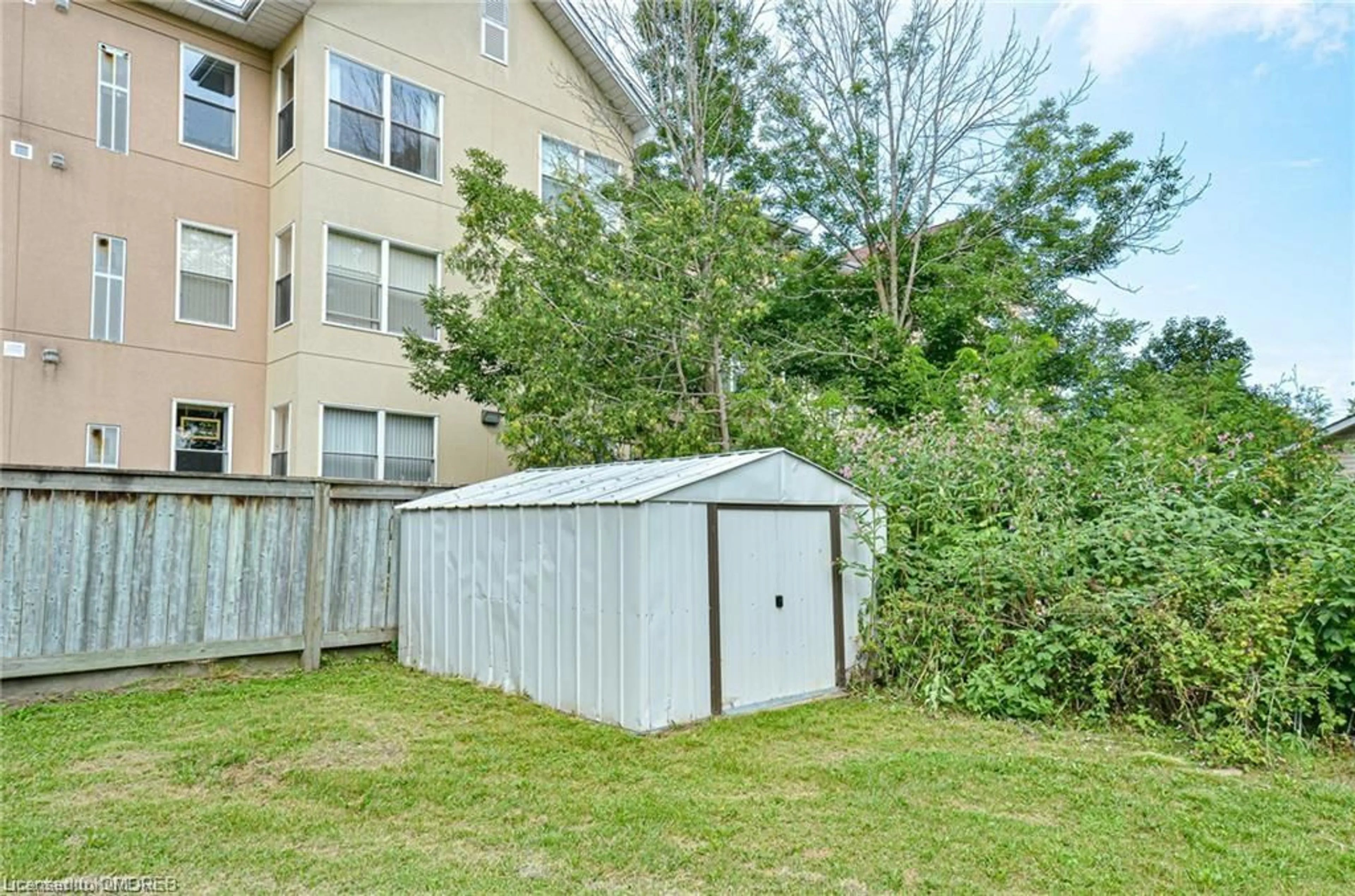 A pic from exterior of the house or condo, the fenced backyard for 9 Simcoe St, Lindsay Ontario K9V 2G2