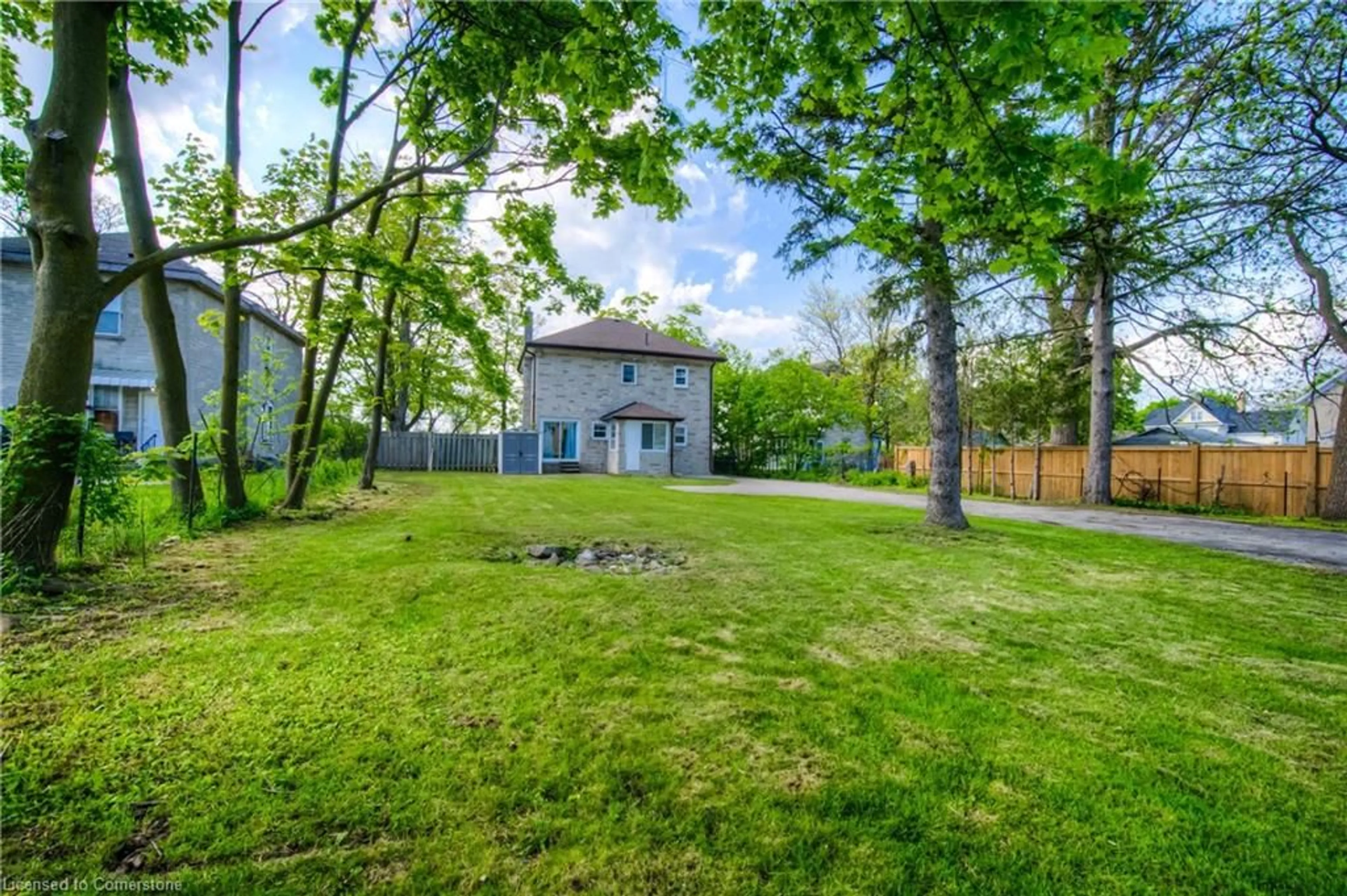 A pic from exterior of the house or condo, the fenced backyard for 332 Queen St, Cambridge Ontario N3C 1G8