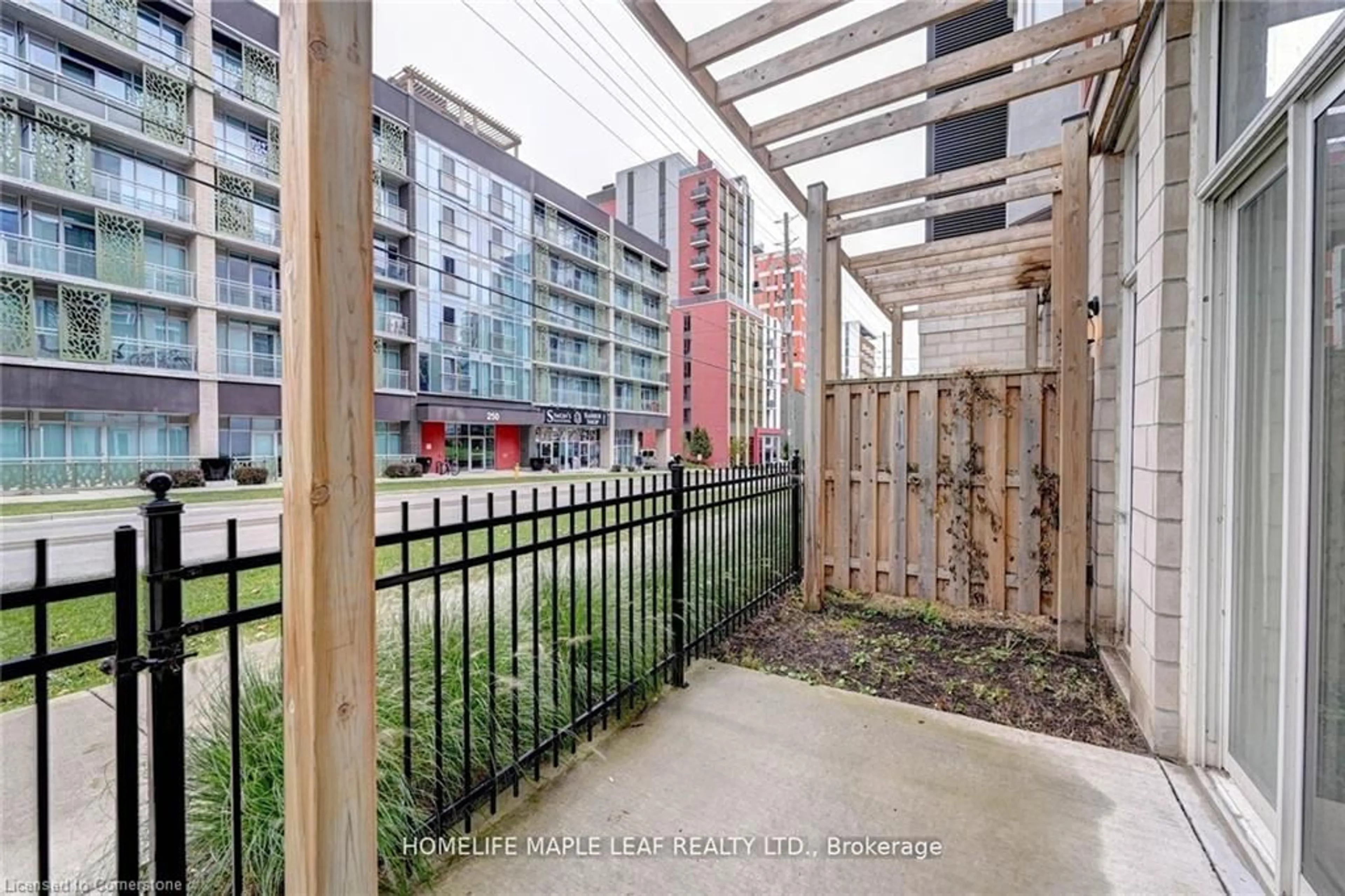 Patio, the fenced backyard for 253 Albert St #106, Waterloo Ontario N2L 0G3