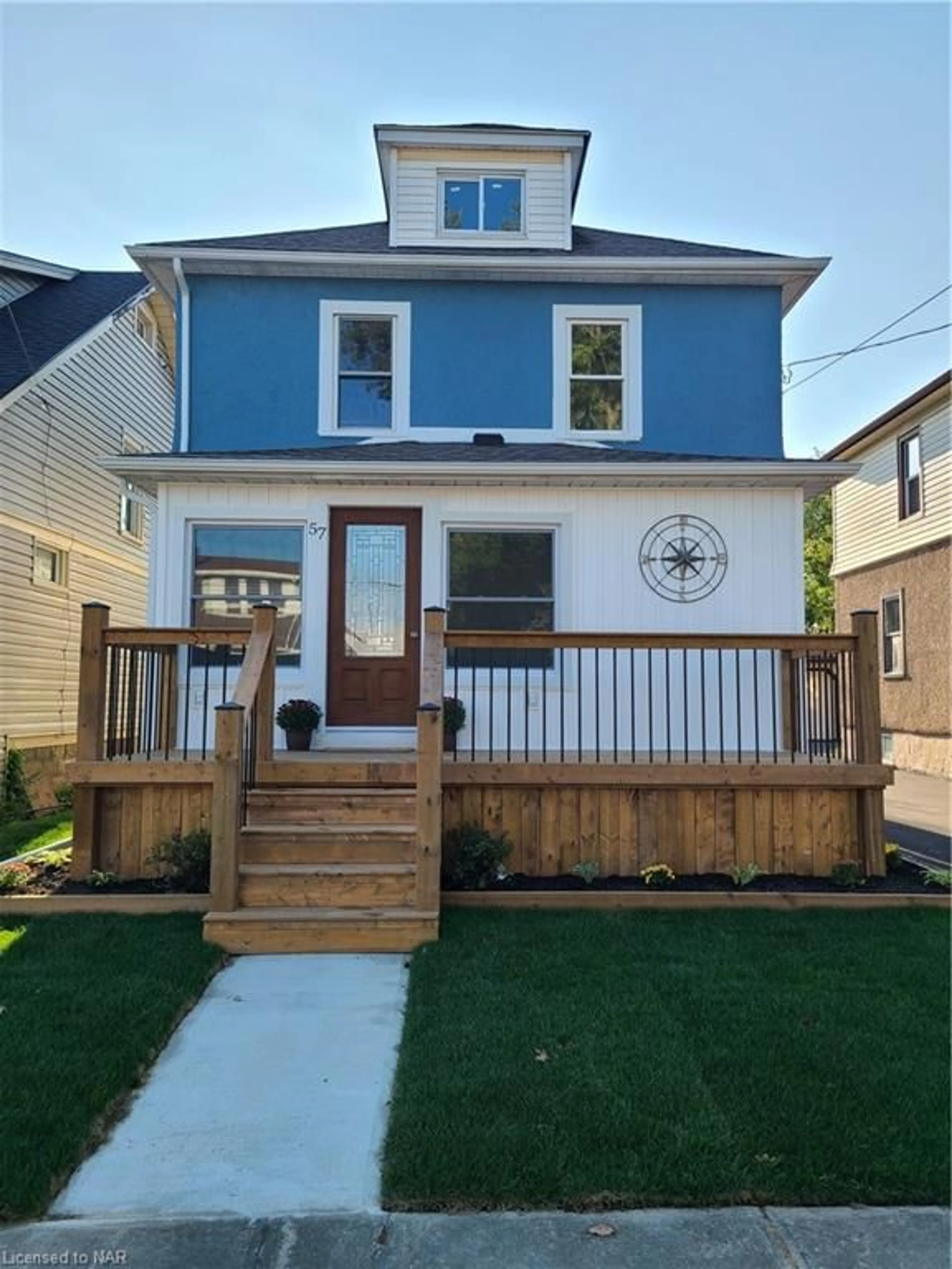 Frontside or backside of a home, the fenced backyard for 57 Oakland Ave, Welland Ontario L3C 2B8