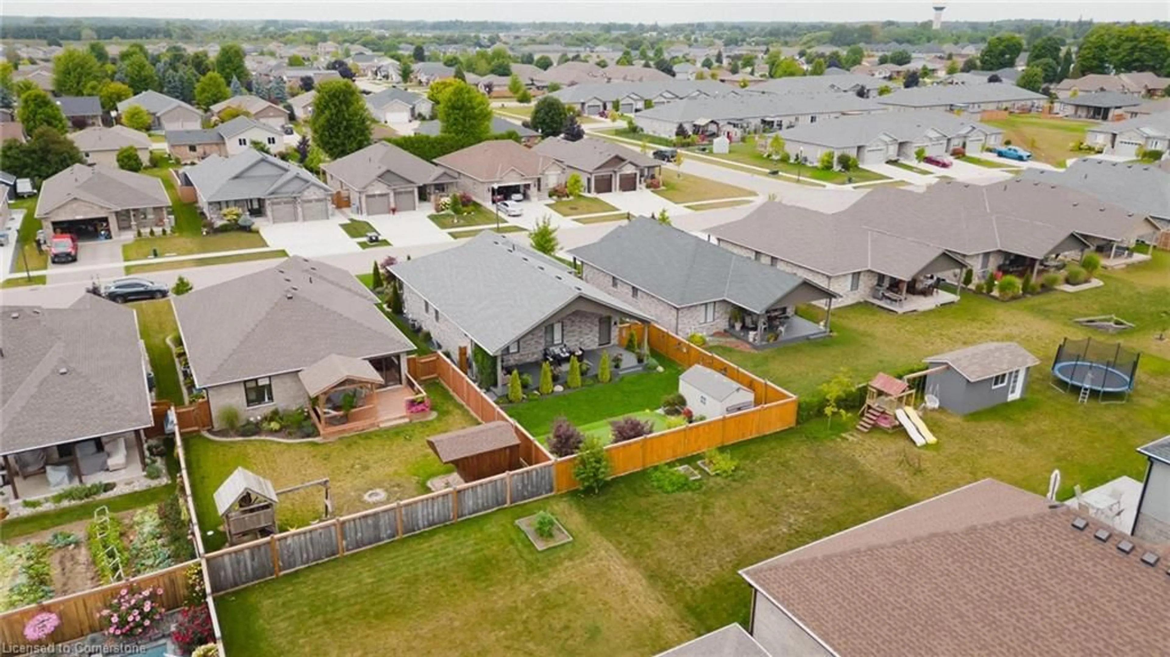 Frontside or backside of a home, the fenced backyard for 32 Forbes Cres, Listowel Ontario N4W 0B9