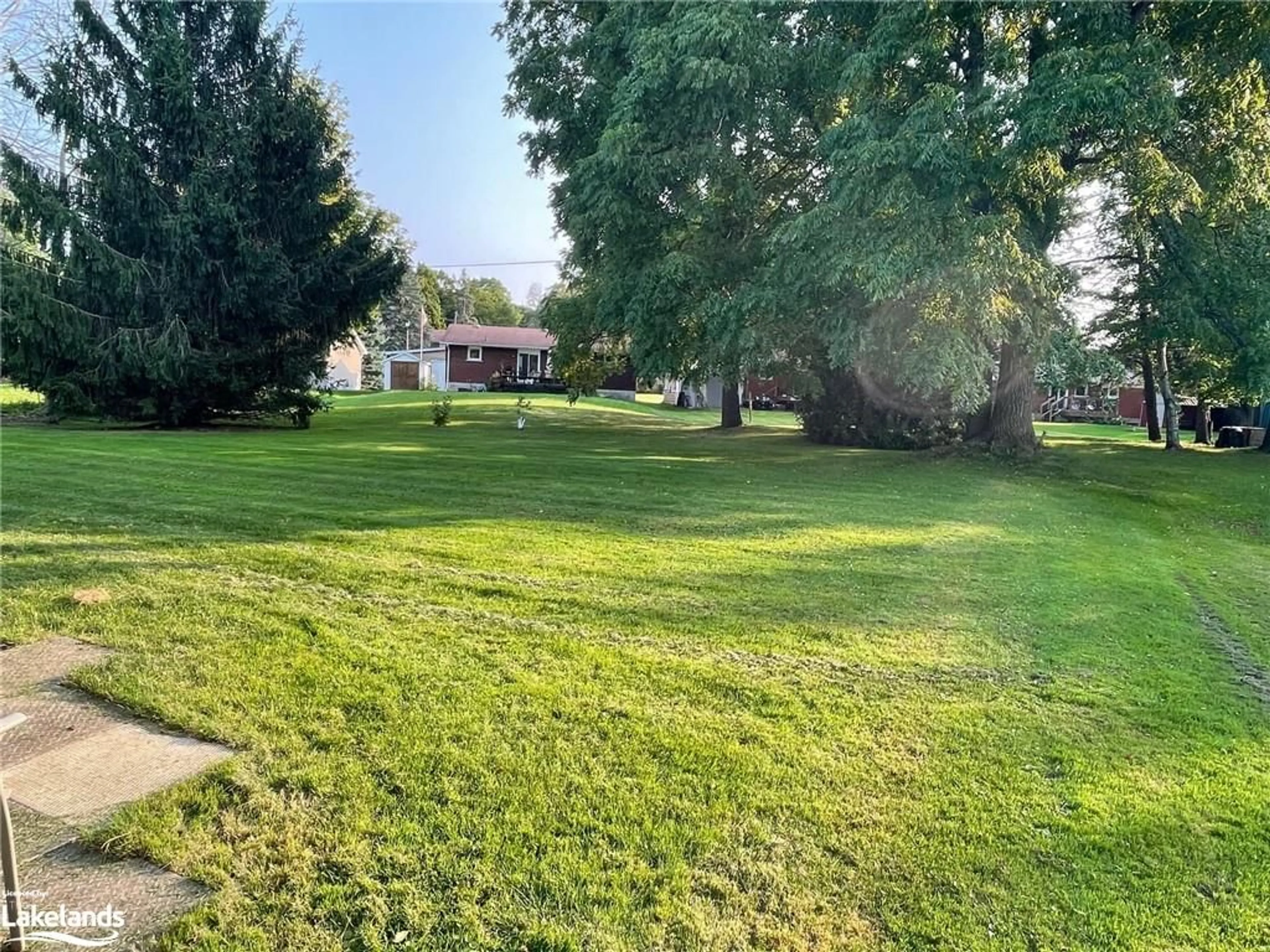 A pic from exterior of the house or condo, the fenced backyard for 33 Centennial Heights Crt, Meaford Ontario N4L 1E5