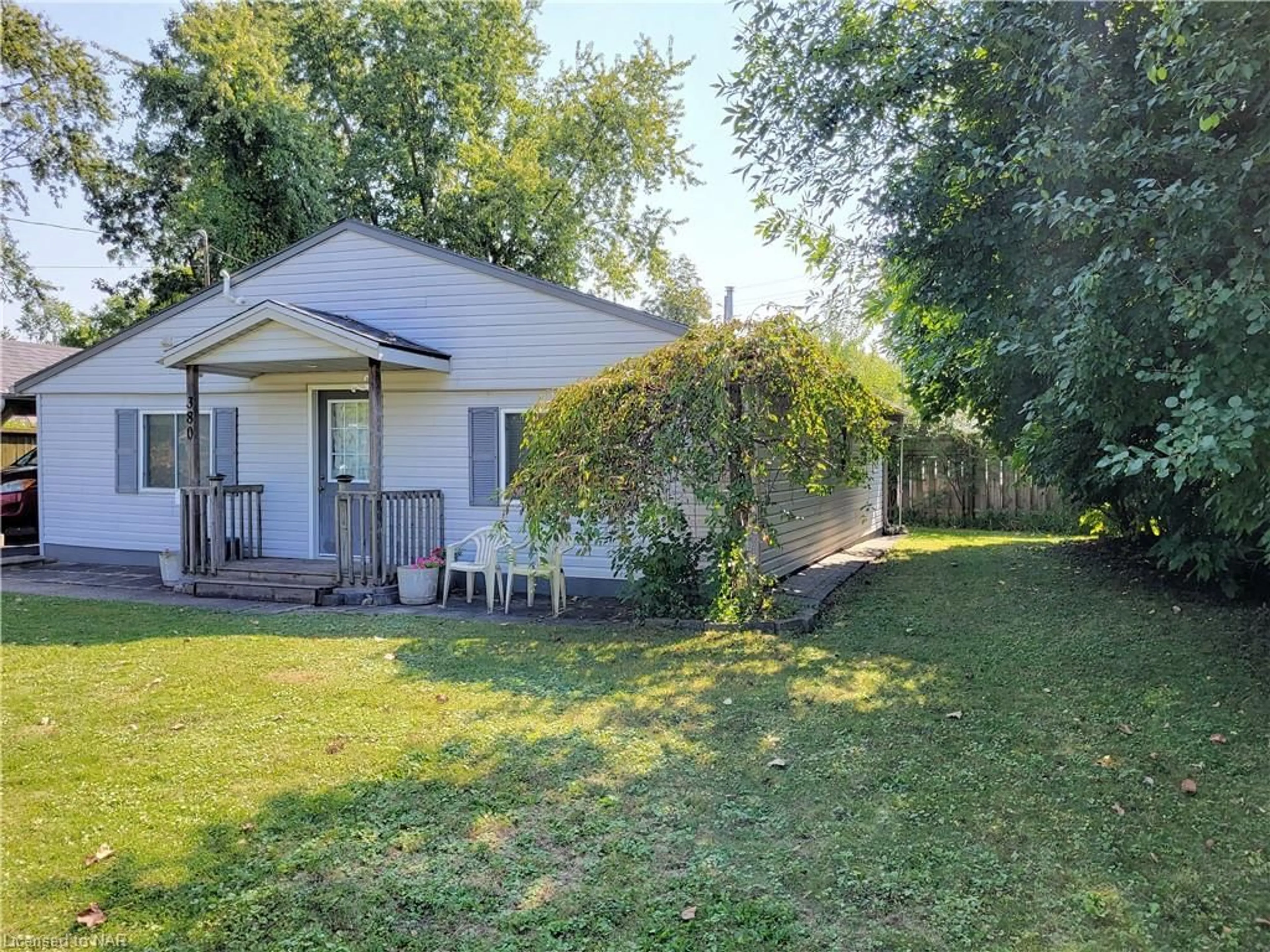 Frontside or backside of a home, the fenced backyard for 380 Washington Rd, Fort Erie Ontario L2A 4K4