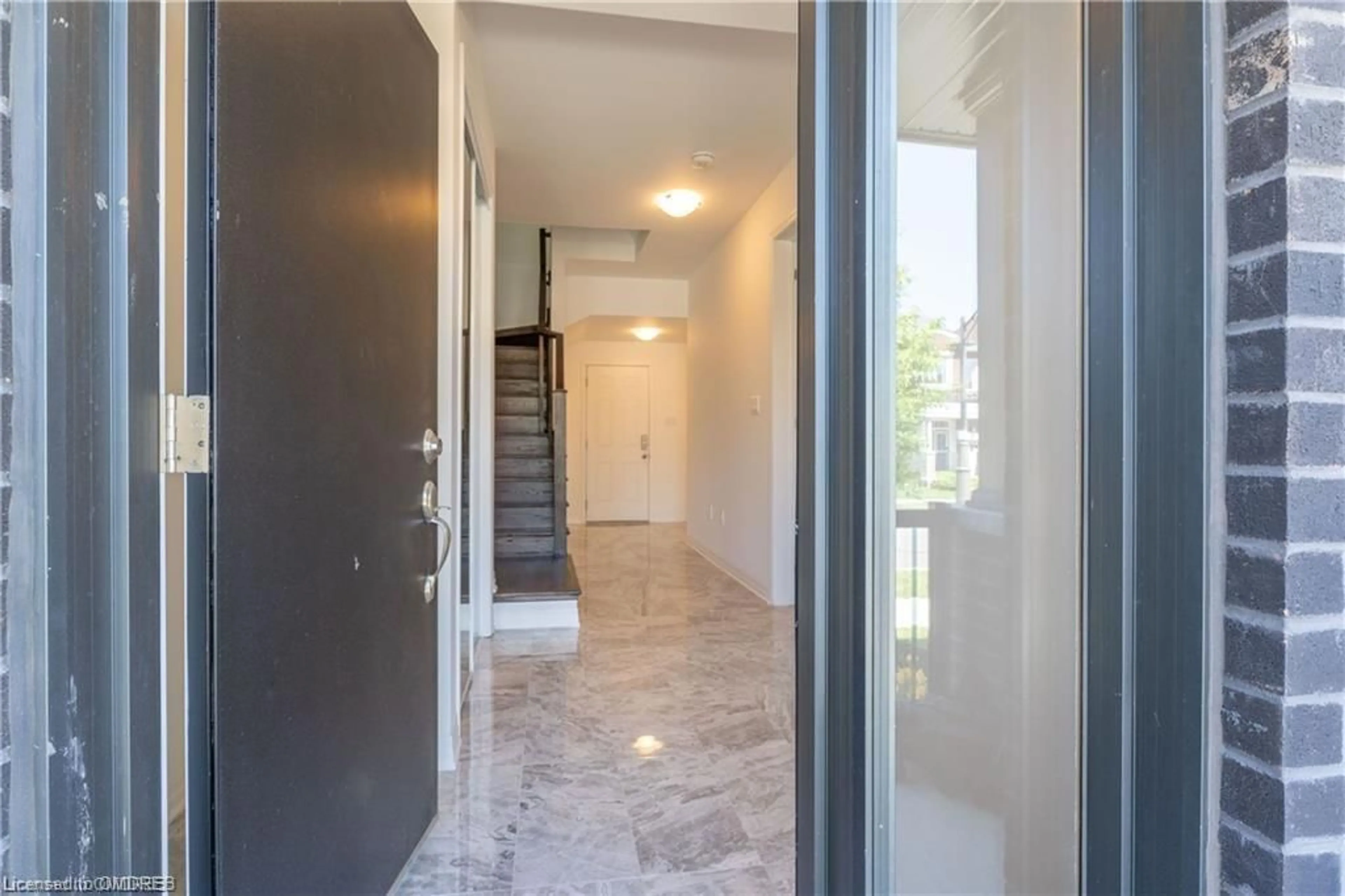 Indoor foyer, cement floor for 84 Kaitting Trail, Oakville Ontario L6M 5N5