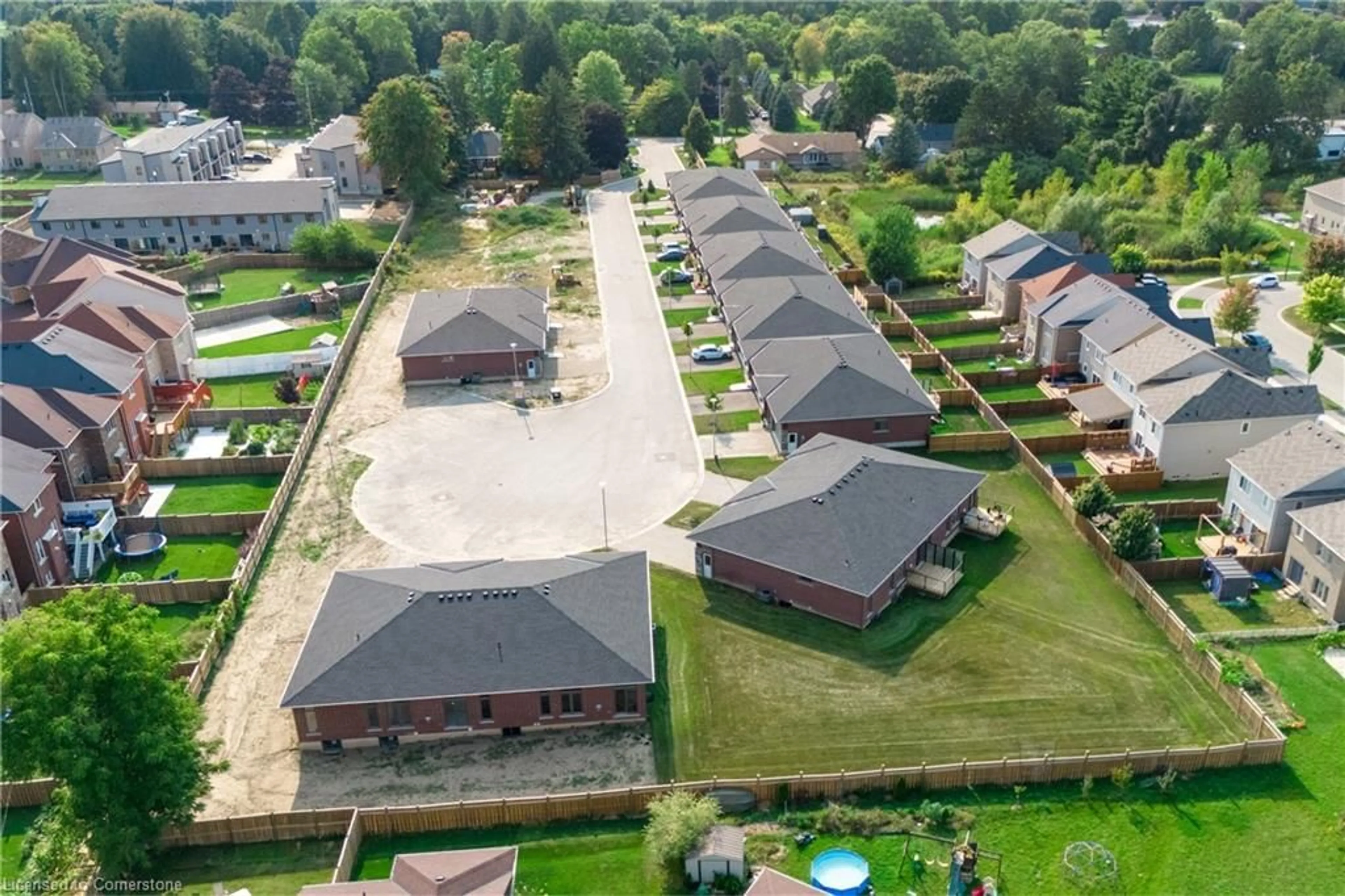 Frontside or backside of a home, the fenced backyard for 269 Pittock Park Rd #13, Woodstock Ontario N4T 0R2