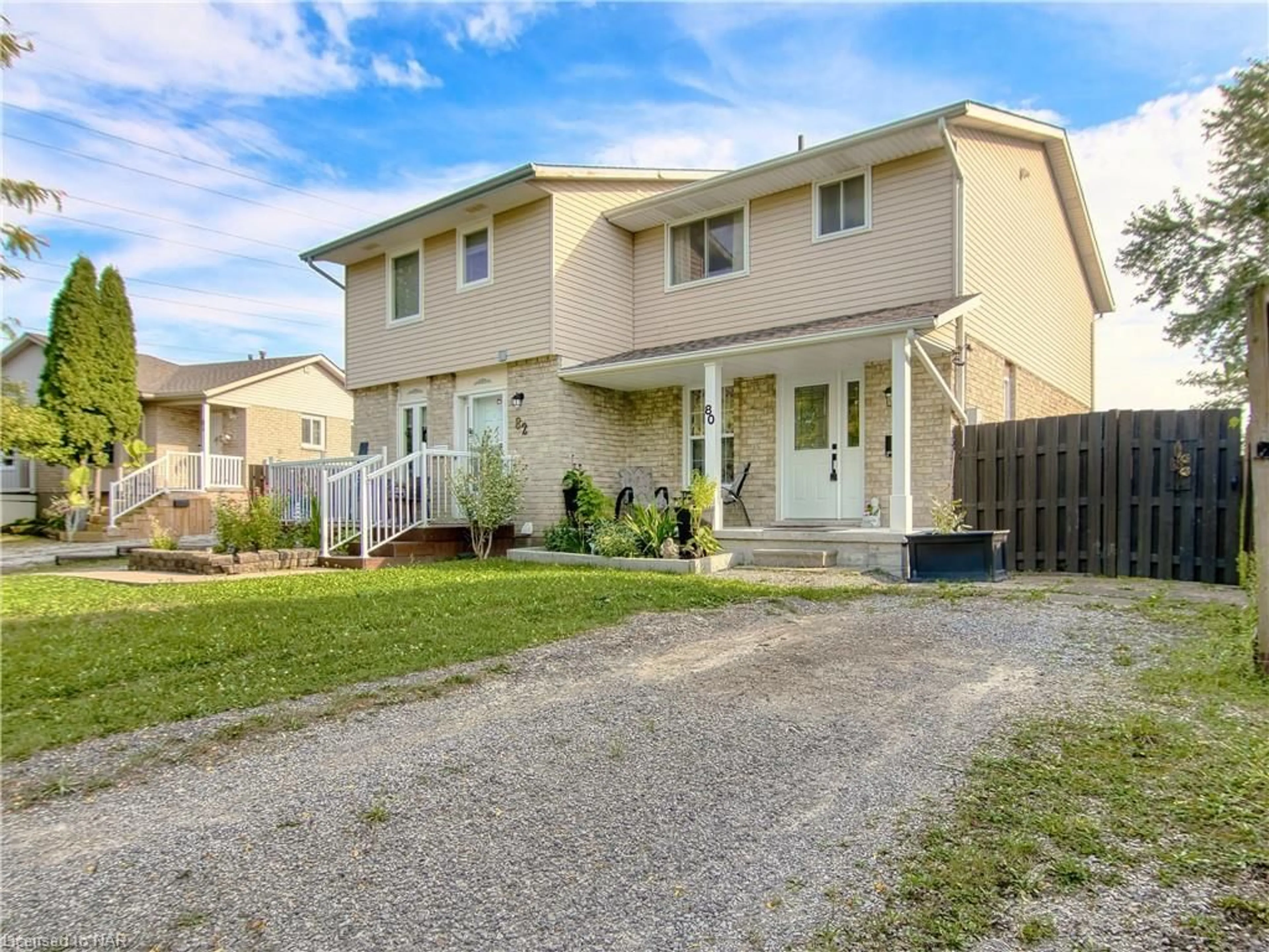 Frontside or backside of a home, the fenced backyard for 80 Oxford St, St. Catharines Ontario L2P 3T6