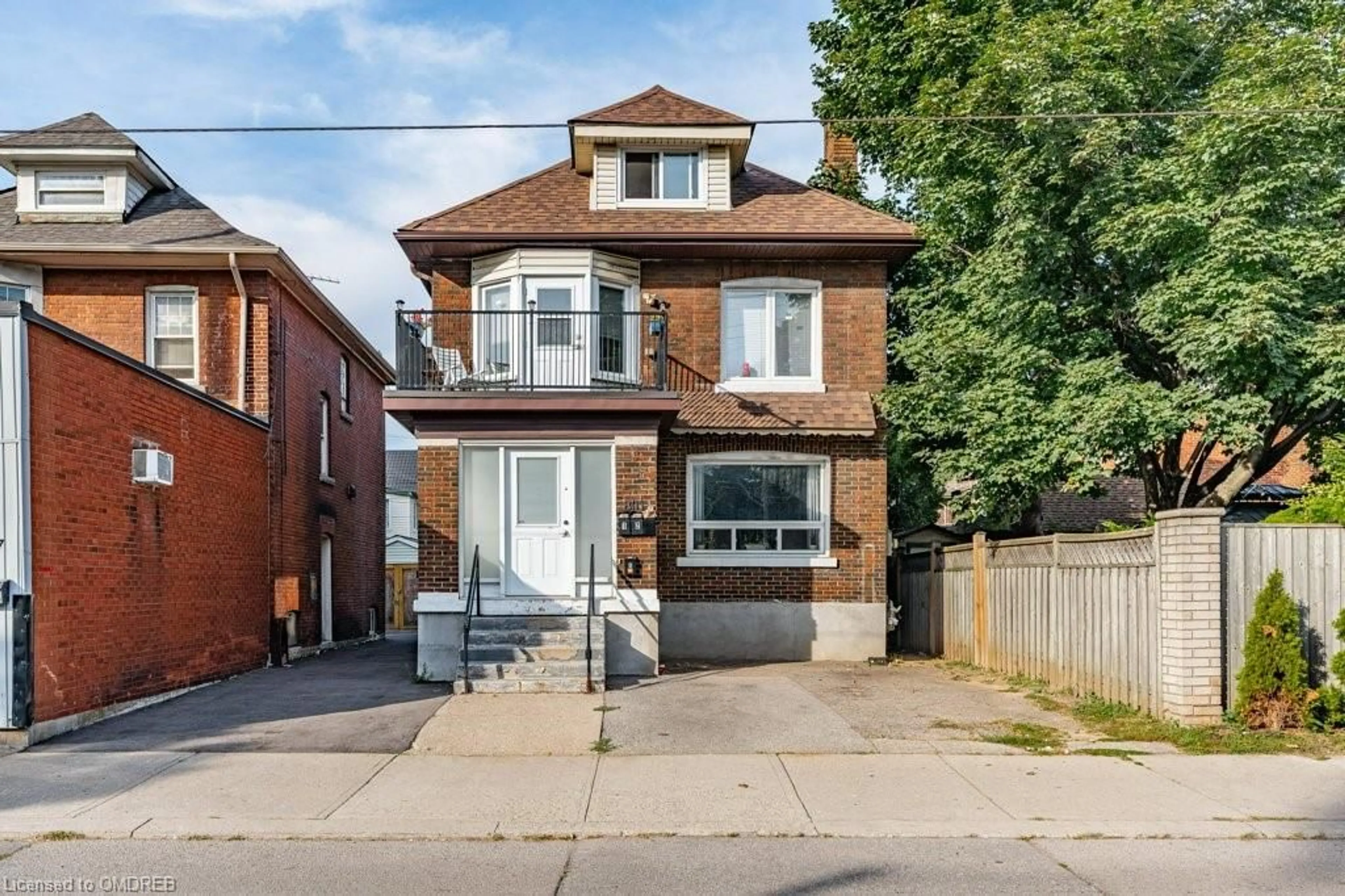 Frontside or backside of a home for 801 Main St, Hamilton Ontario L8M 1L5