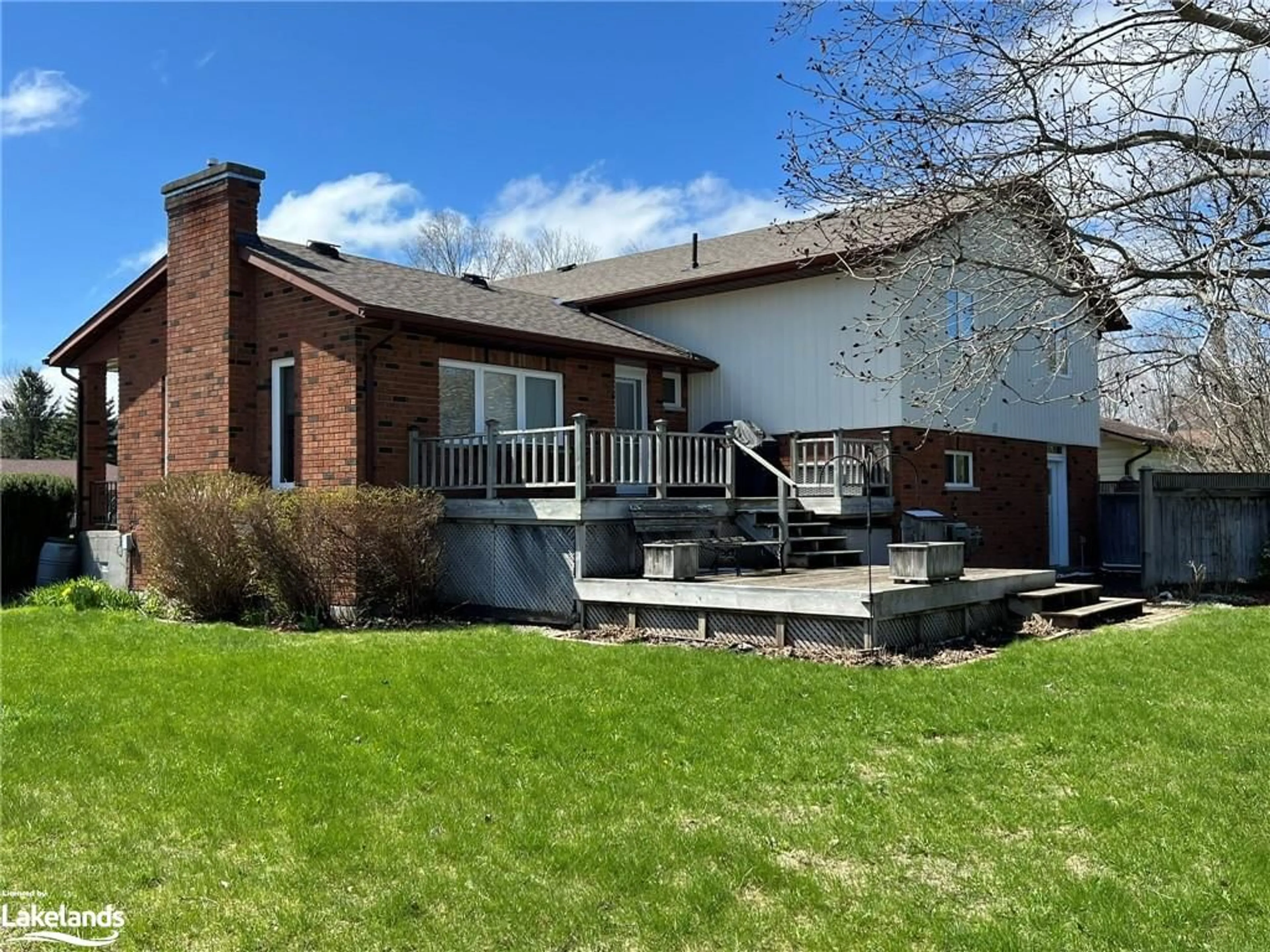 Frontside or backside of a home, the fenced backyard for 42 Francis St, Creemore Ontario L0M 1G0