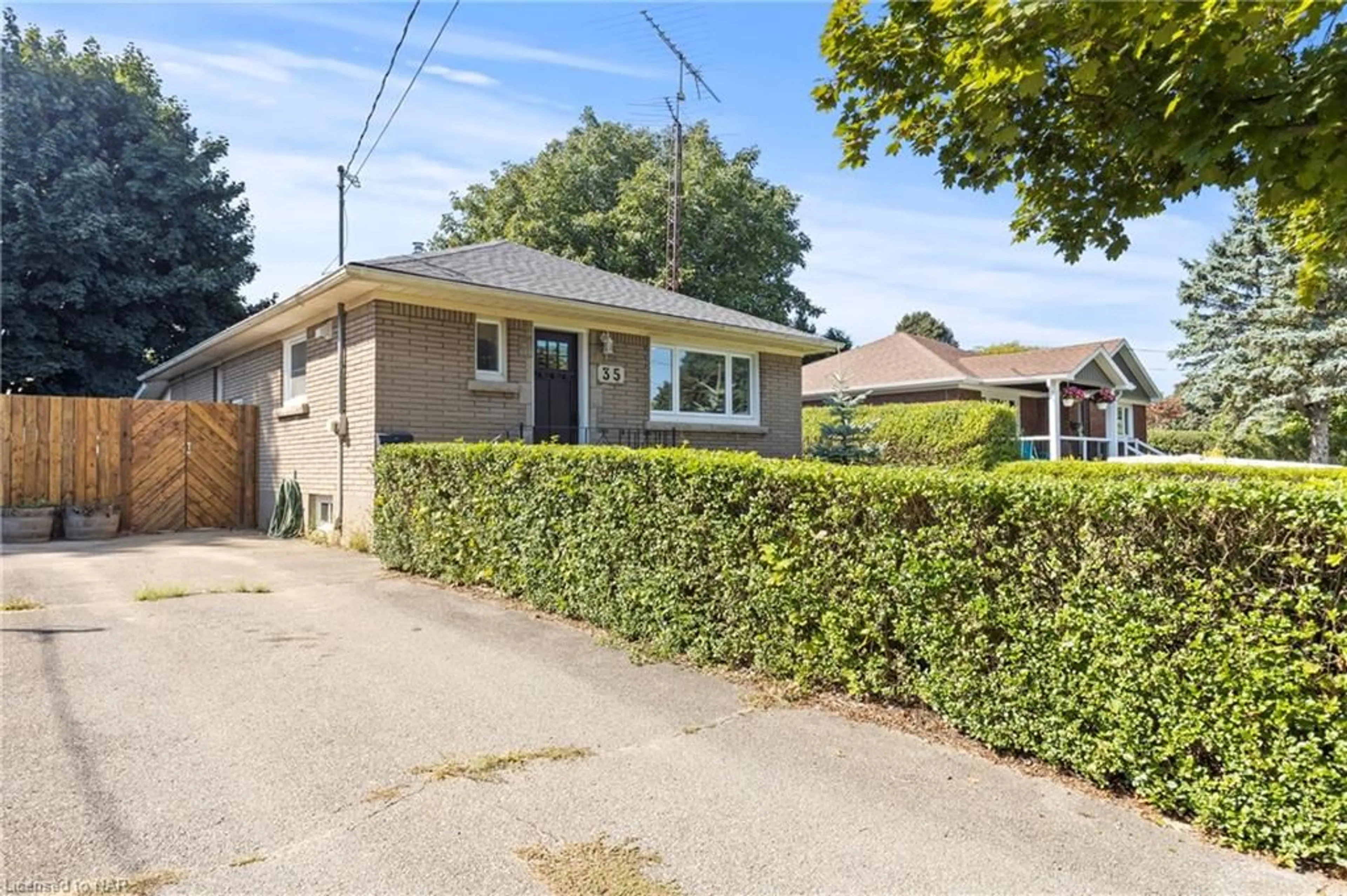 Frontside or backside of a home, the street view for 35 Dunblane Ave, St. Catharines Ontario L2M 3Z8