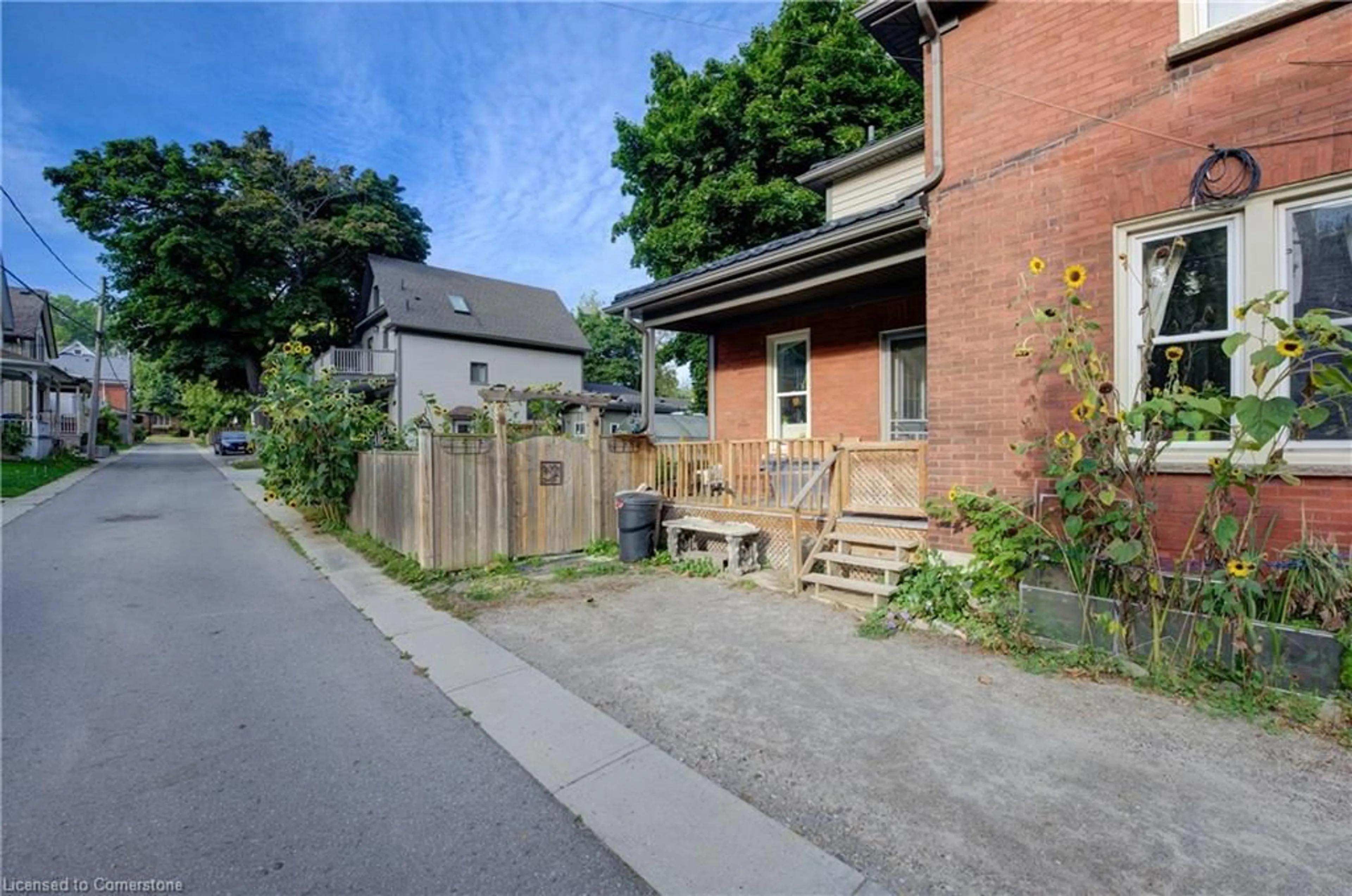 A pic from exterior of the house or condo, the fenced backyard for 15 St Leger St, Kitchener Ontario N2H 4L8