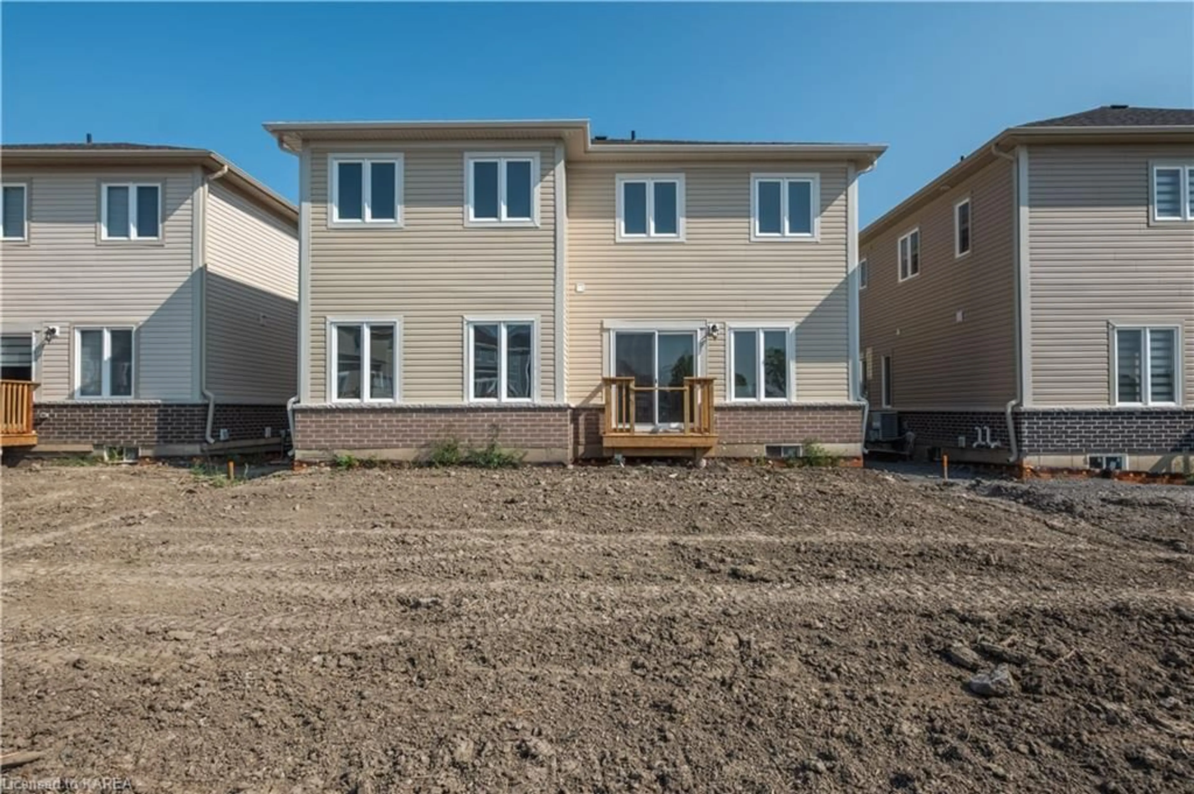 Frontside or backside of a home, the fenced backyard for 117 Windermere Blvd, Bath Ontario K0H 1G0