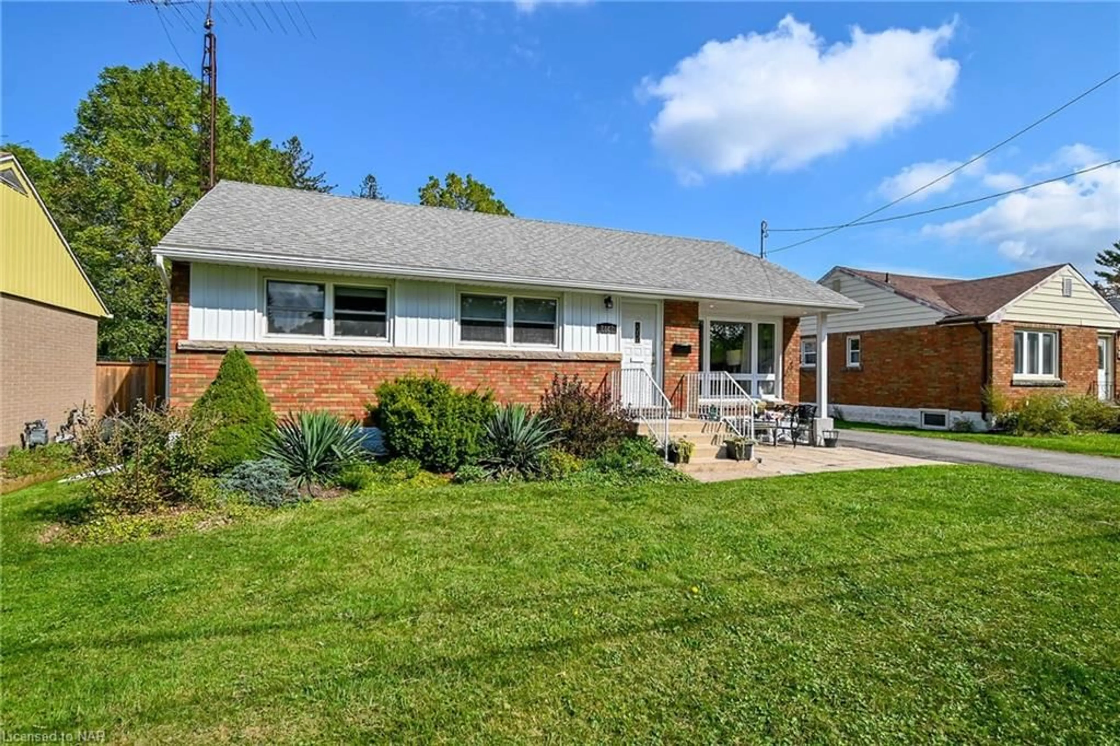 Frontside or backside of a home, the fenced backyard for 7027 Garden St, Niagara Falls Ontario L2G 1H8