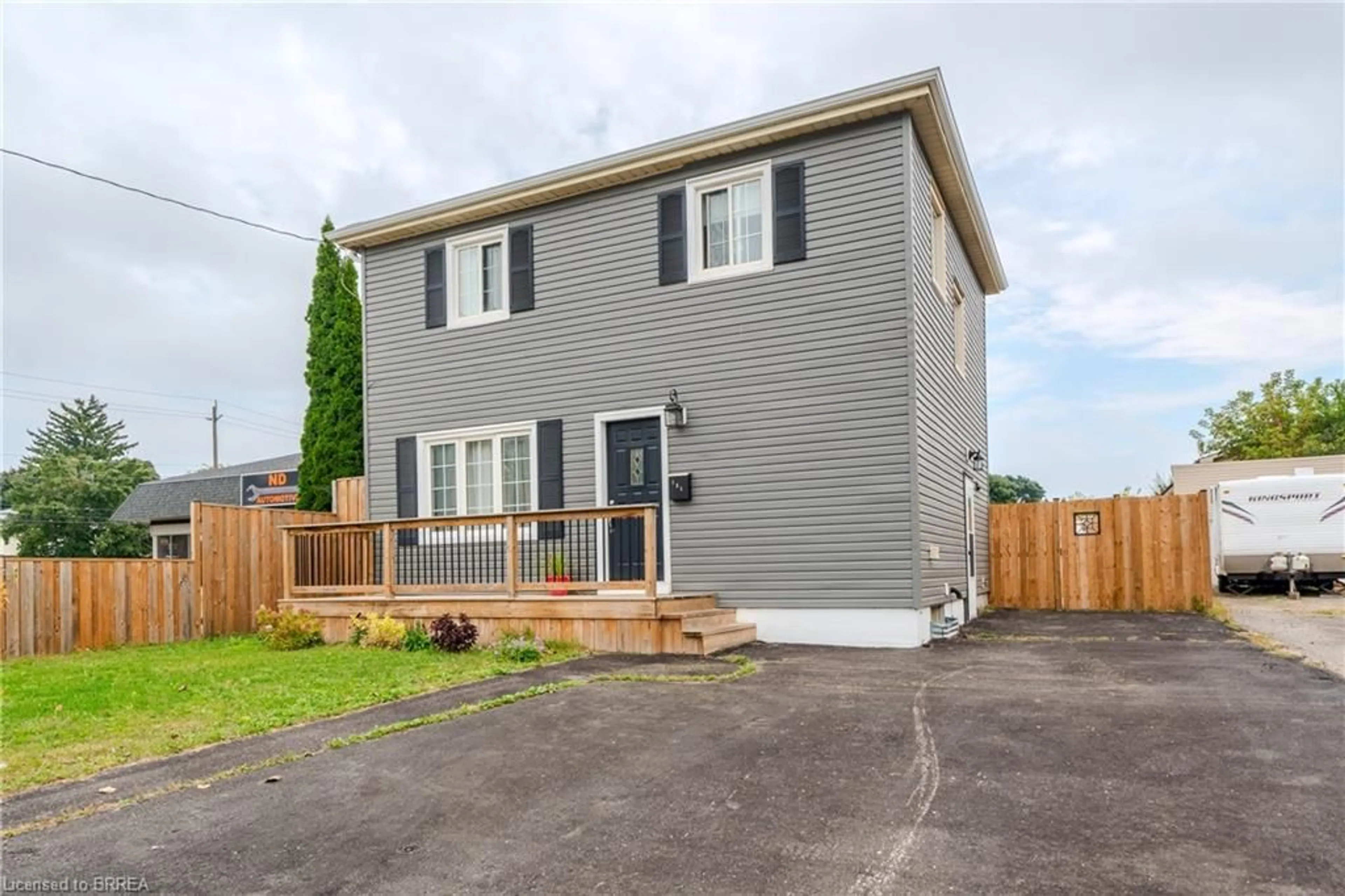 Frontside or backside of a home, the fenced backyard for 131 Morrell St, Brantford Ontario N3T 4J9