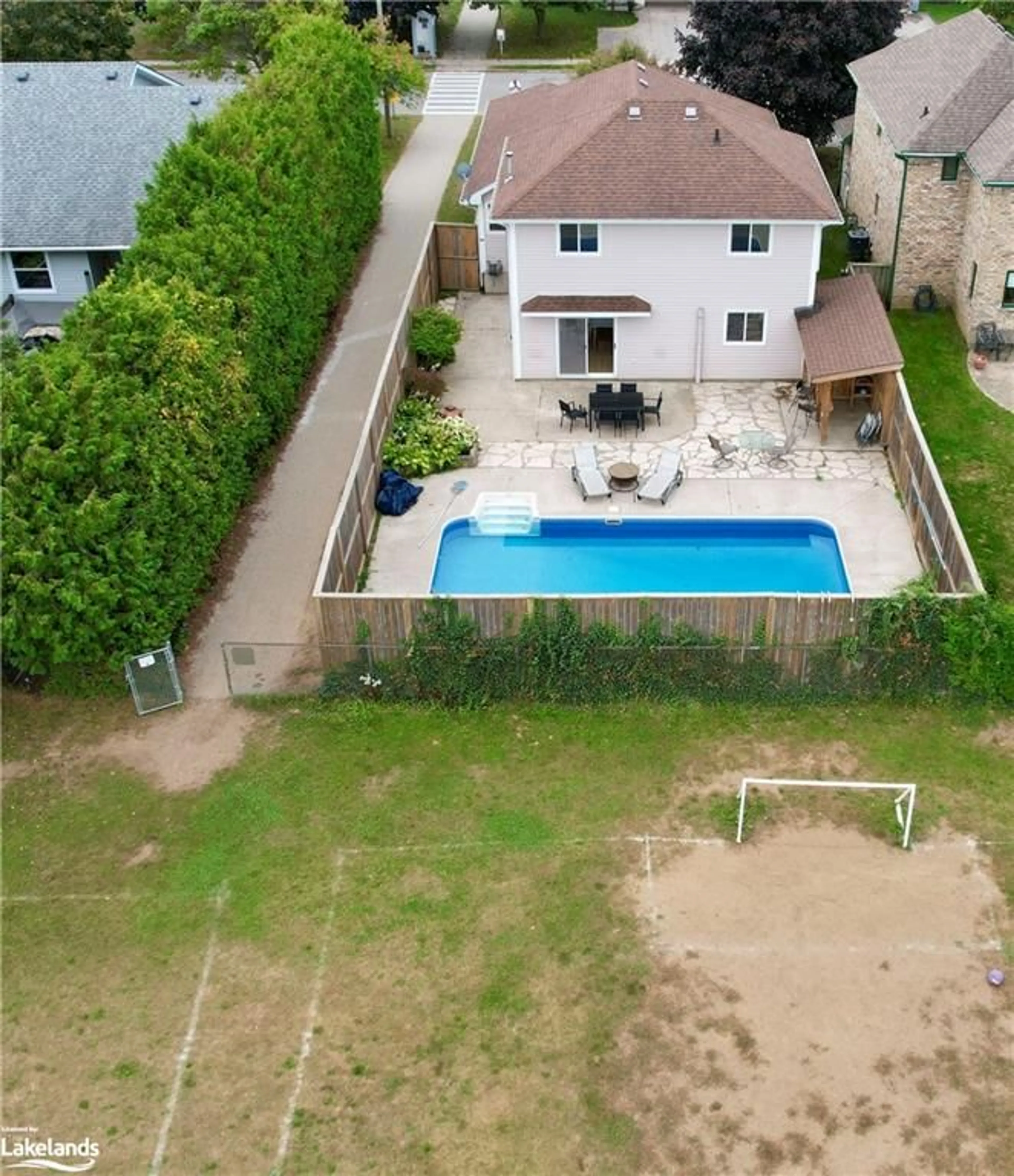 Frontside or backside of a home, the fenced backyard for 507 Joseph St, Port Elgin Ontario N0H 2C2