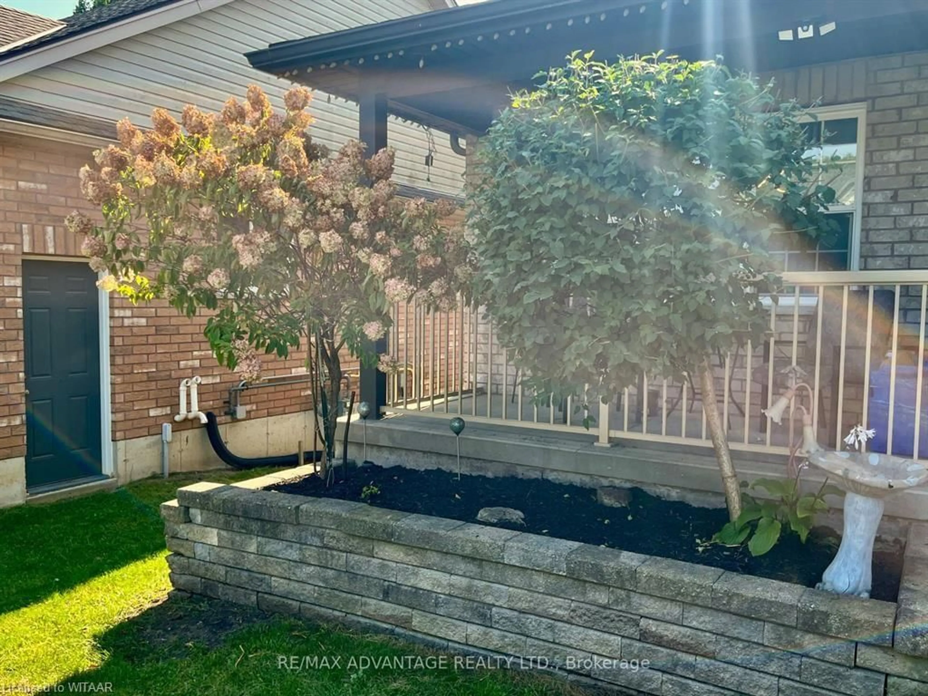 Frontside or backside of a home, the fenced backyard for 12 Henderson Crt, Ingersoll Ontario N5C 0A1