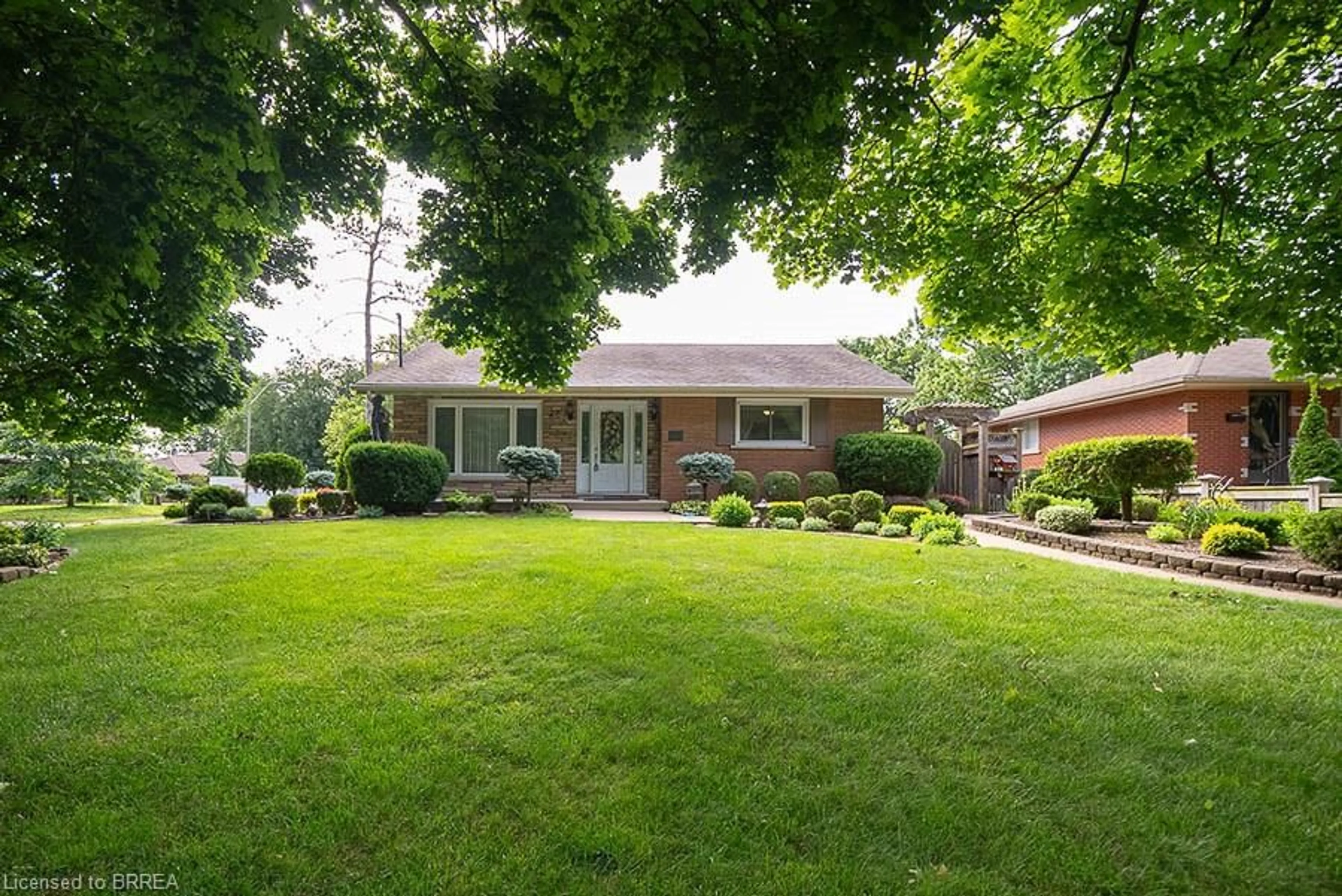 Frontside or backside of a home, the fenced backyard for 20 Allwood St, Brantford Ontario N3R 2V1