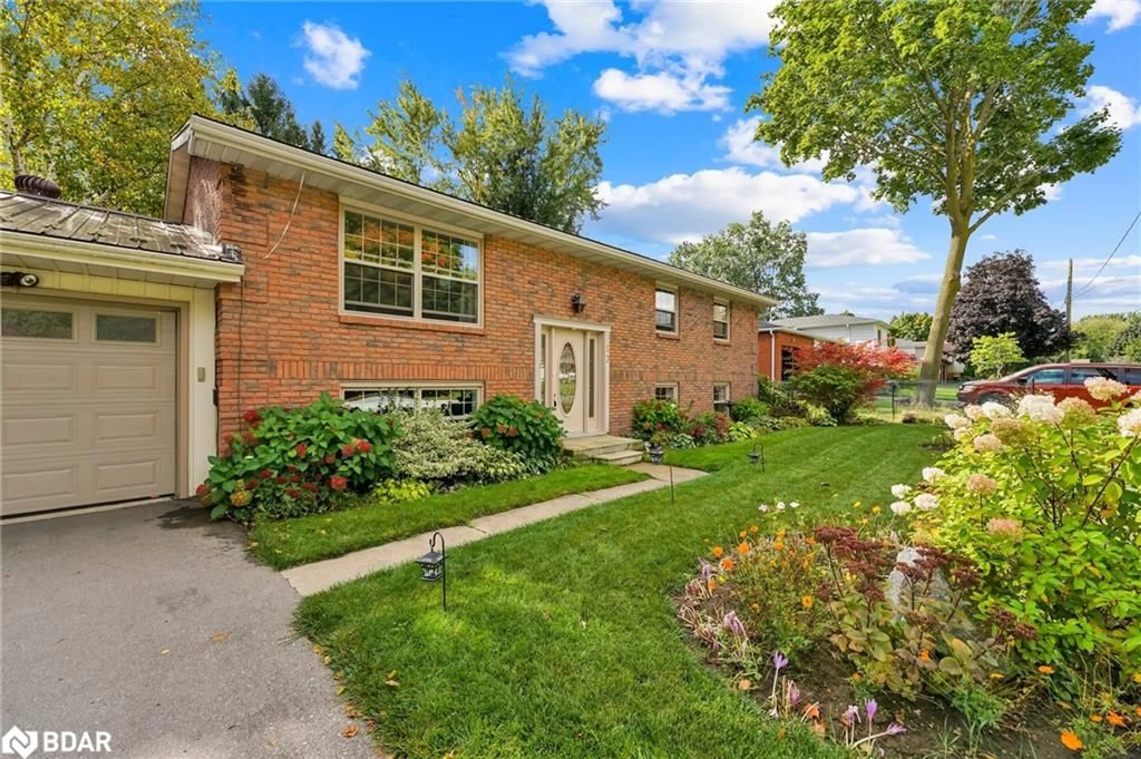 A pic from exterior of the house or condo, the fenced backyard for 13 Jardine Cres, Creemore Ontario L0M 1G0