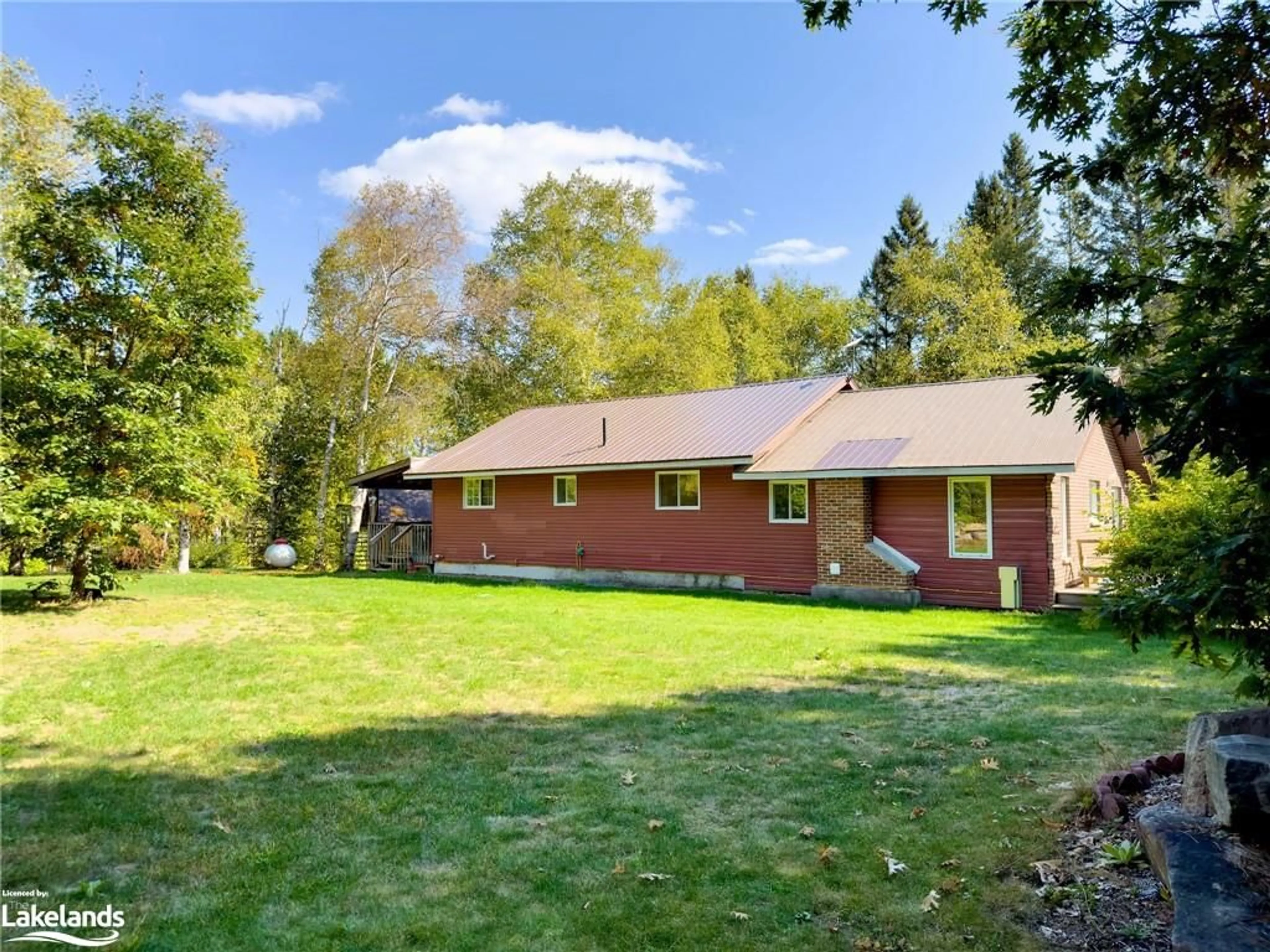 Frontside or backside of a home, the fenced backyard for 316 Goreville Rd, South River Ontario P0A 1X0