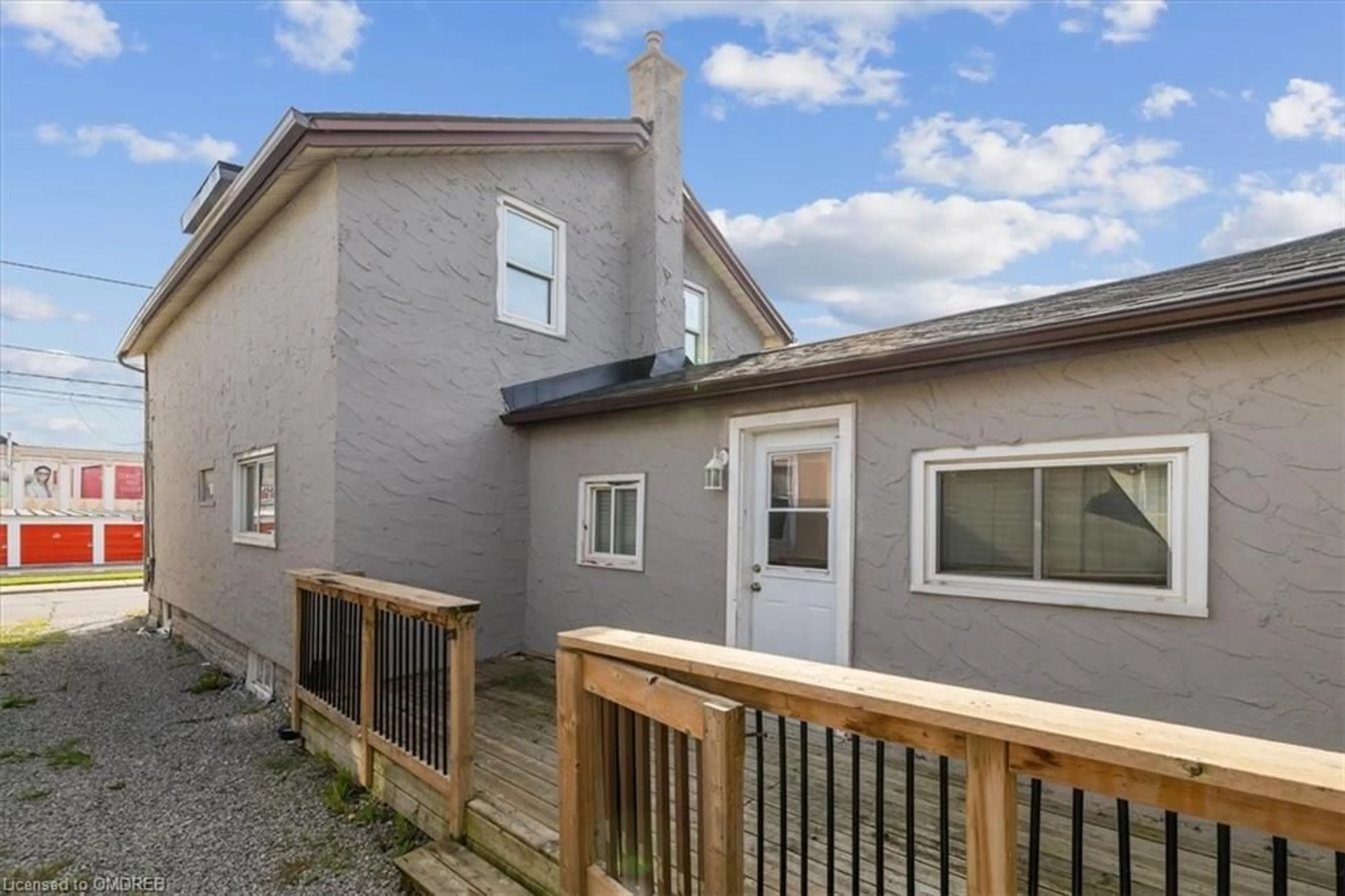 Frontside or backside of a home, the fenced backyard for 73 Vine St, St. Catharines Ontario L2R 3X9