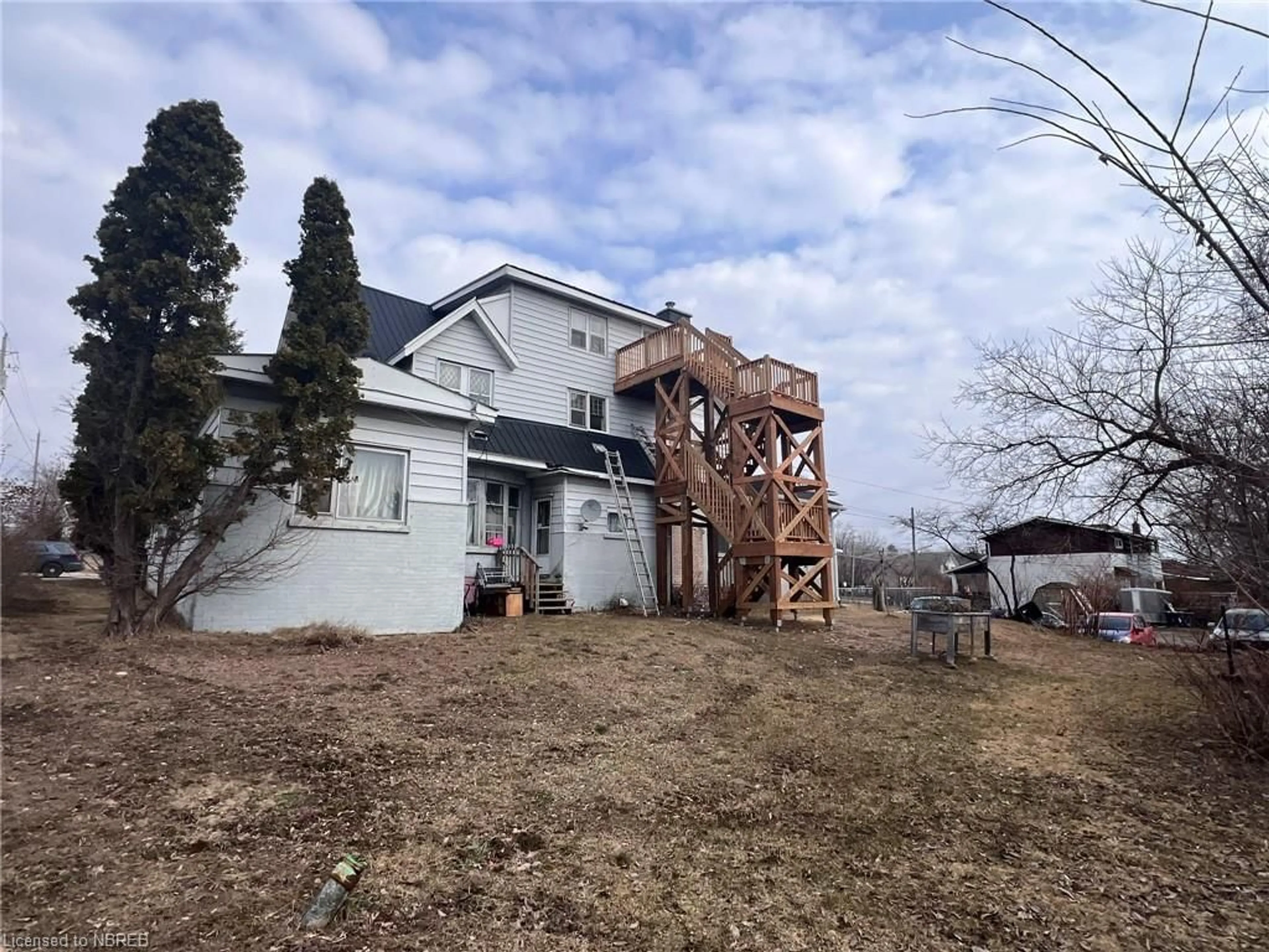 Frontside or backside of a home, the fenced backyard for 525 High St, North Bay Ontario P1B 6R5