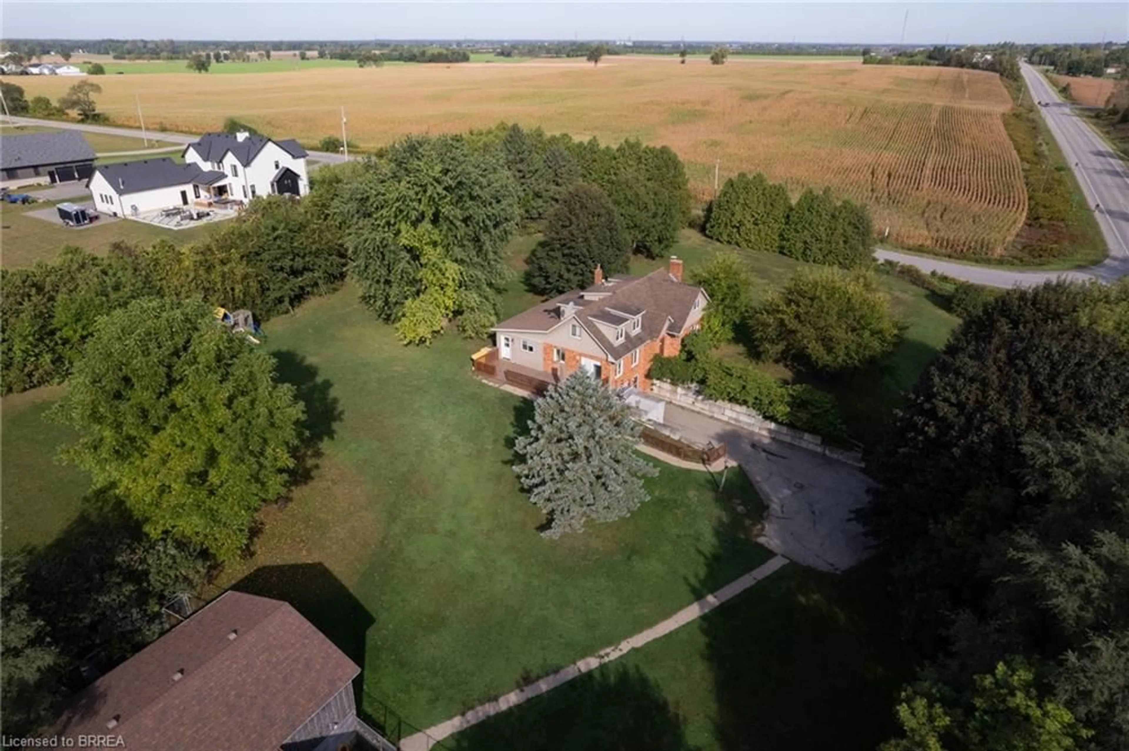 Frontside or backside of a home, the fenced backyard for 93 Simcoe St, Scotland Ontario N0E 1R0