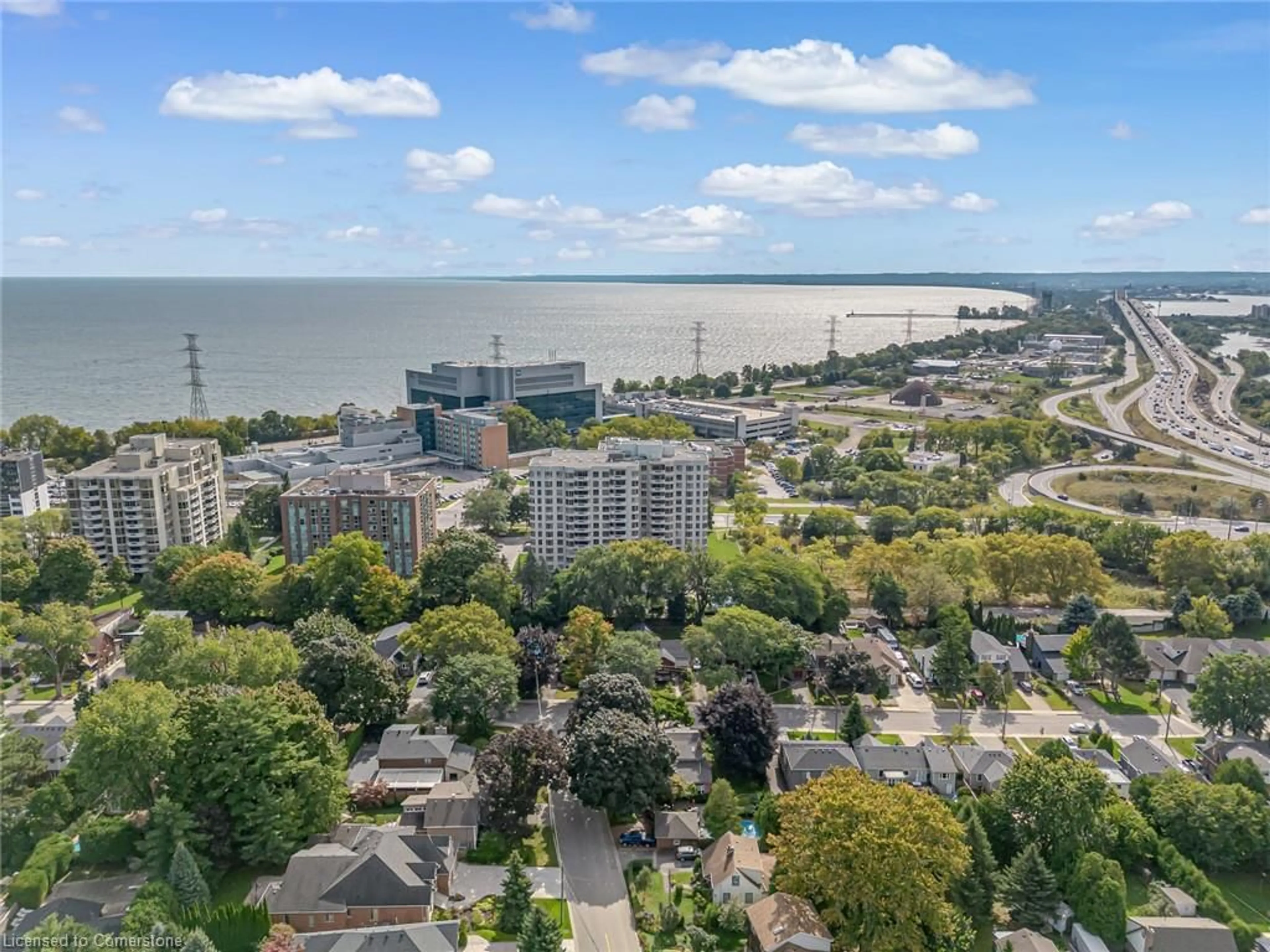 A pic from exterior of the house or condo, the view of city buildings for 1201 North Shore Blvd #606, Burlington Ontario L7S 1Z5