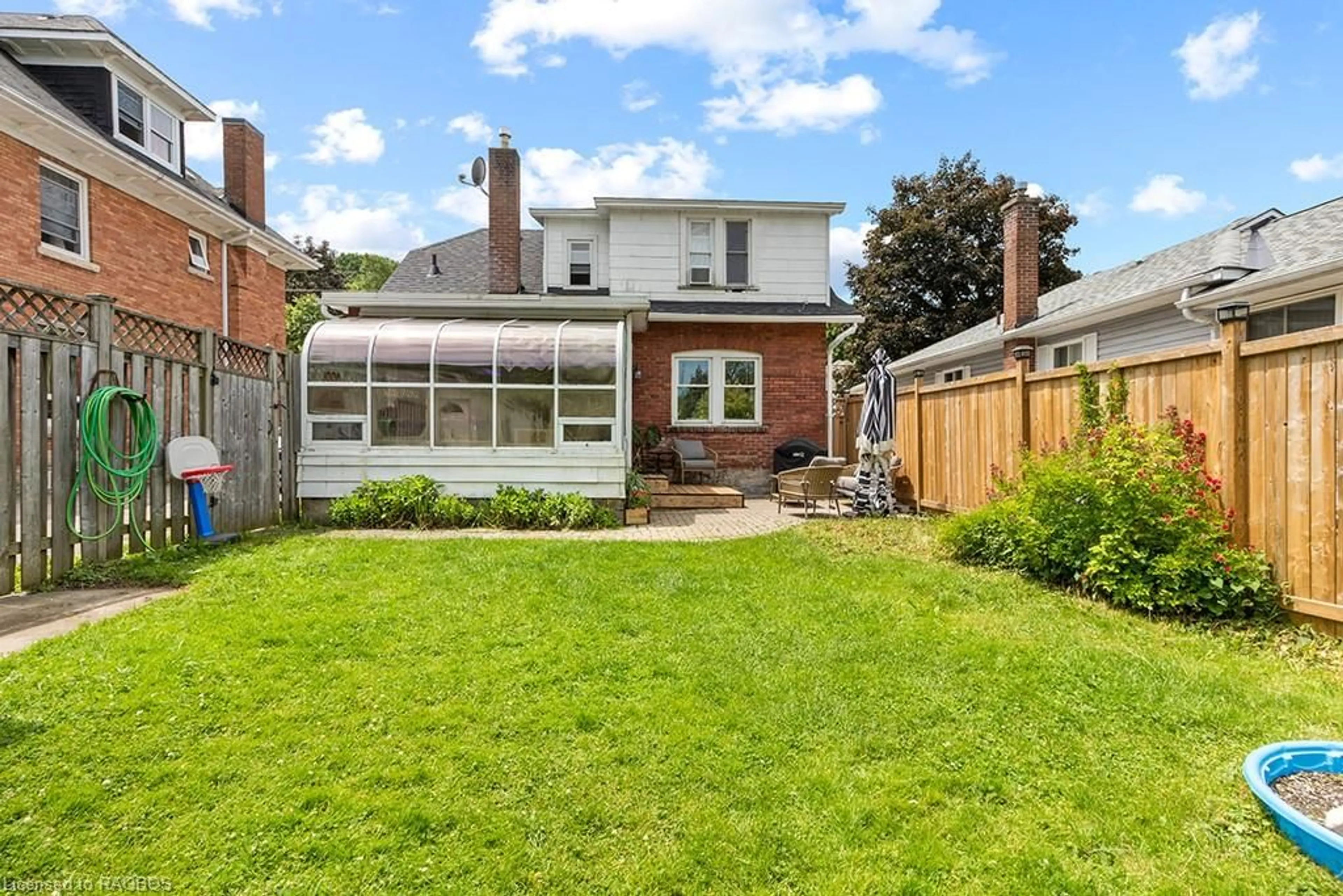 Frontside or backside of a home, the fenced backyard for 1131 4th Ave, Owen Sound Ontario N4K 4W3