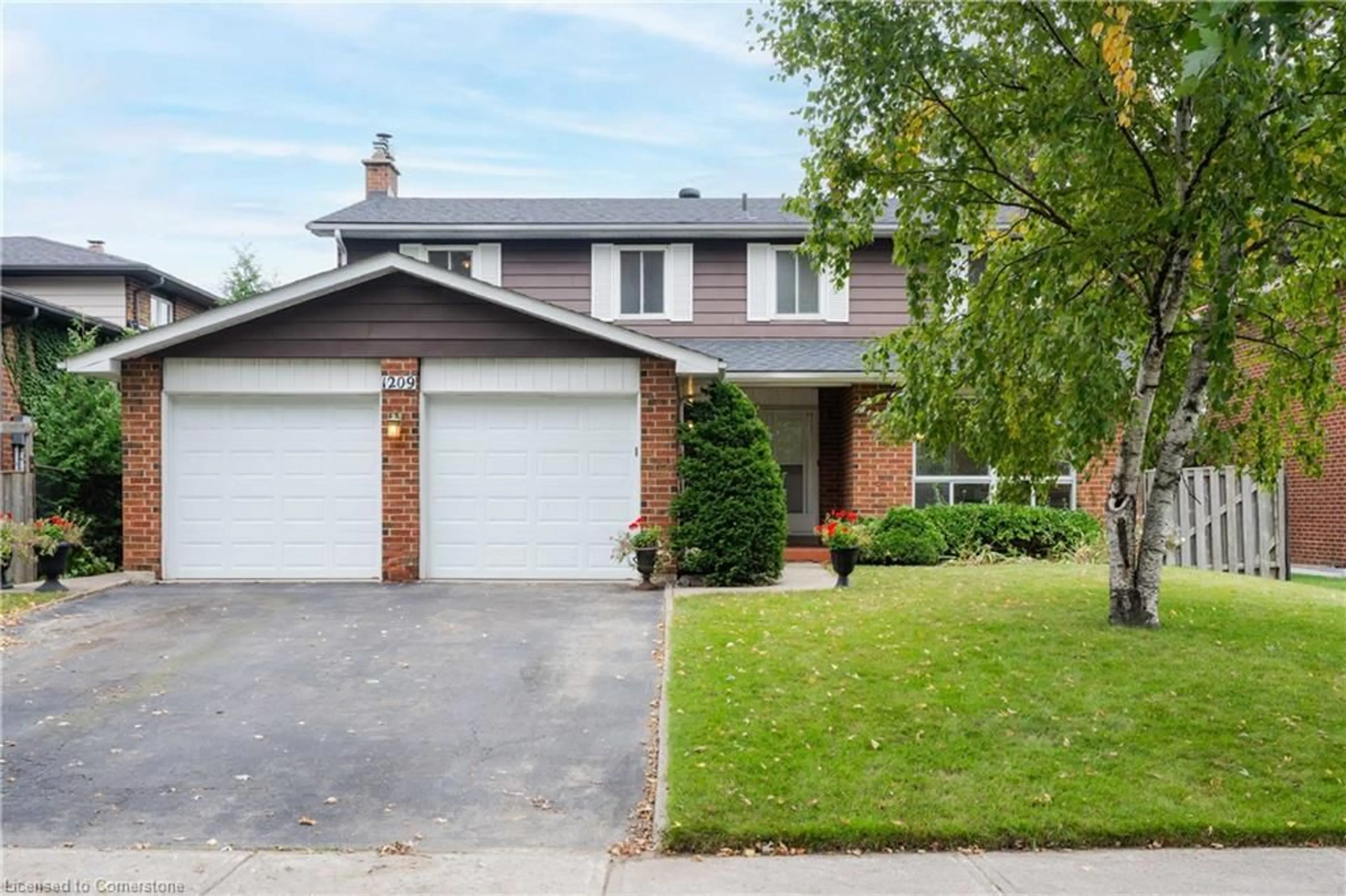 Home with brick exterior material for 1209 Melton Dr, Mississauga Ontario L4Y 4B1