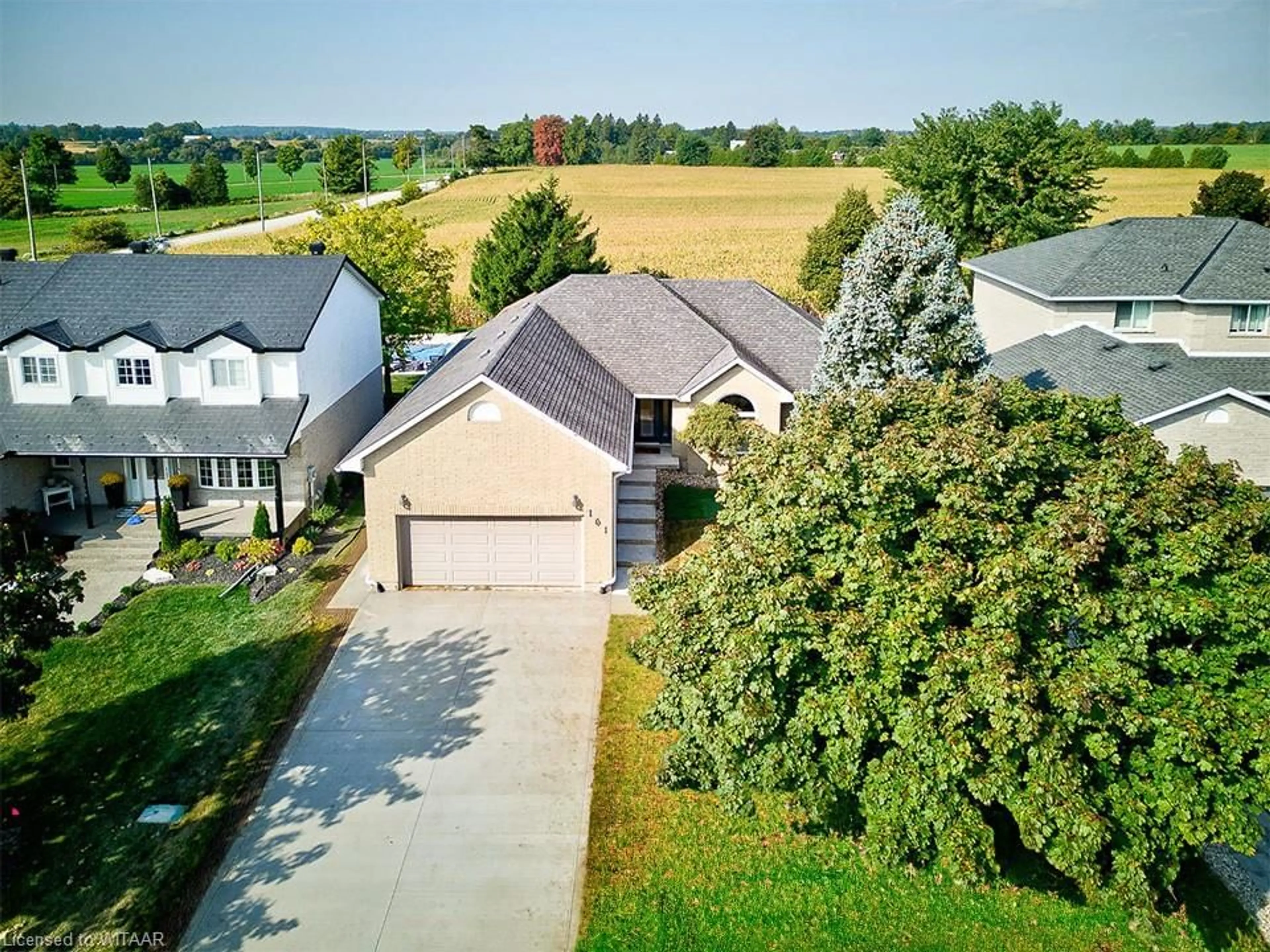 Frontside or backside of a home, the fenced backyard for 161 Lawrence St, Wellesley Ontario N0B 2T0