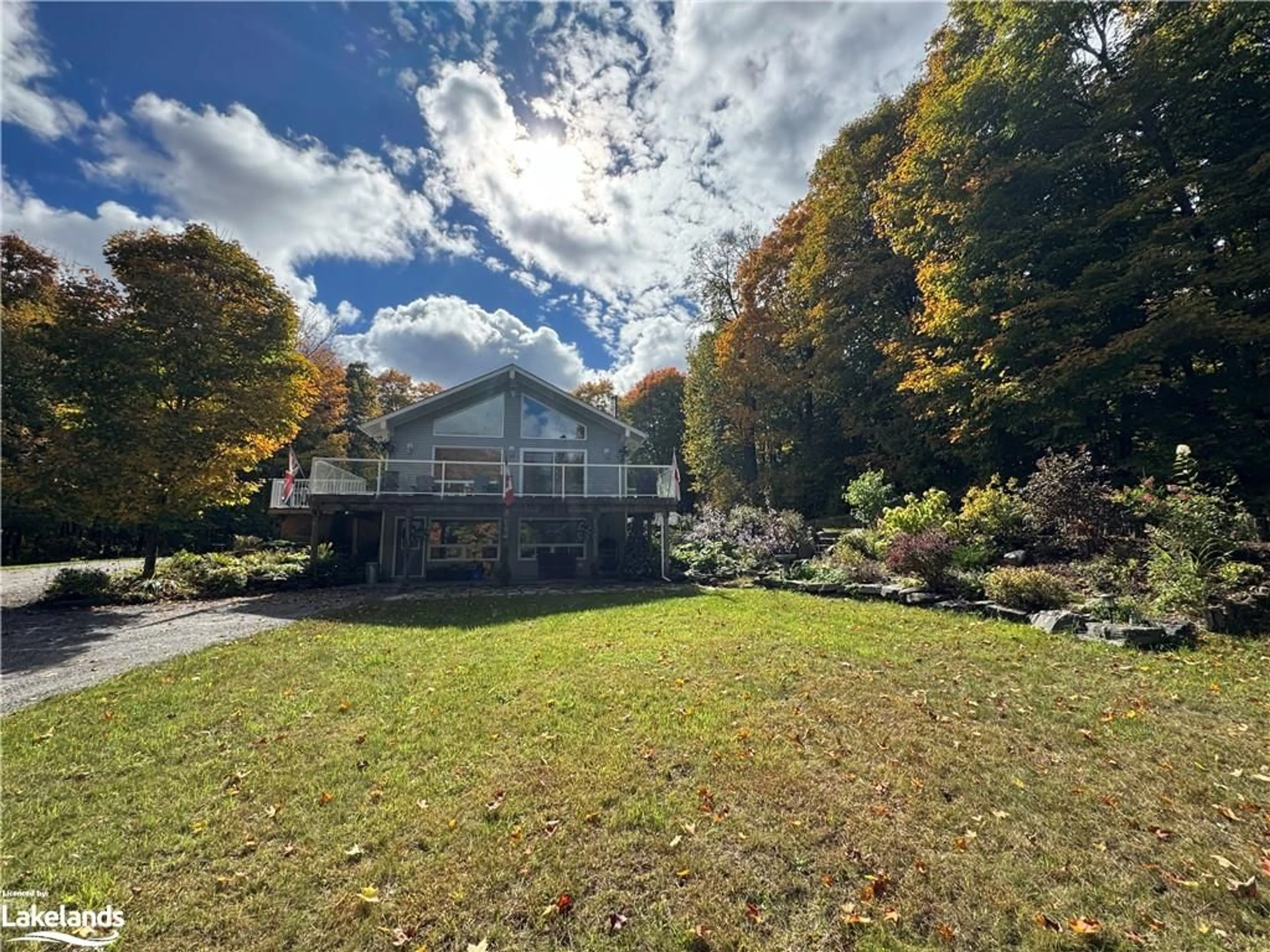 Frontside or backside of a home, the fenced backyard for 825 Madill Rd, Burk's Falls Ontario P0A 1C0