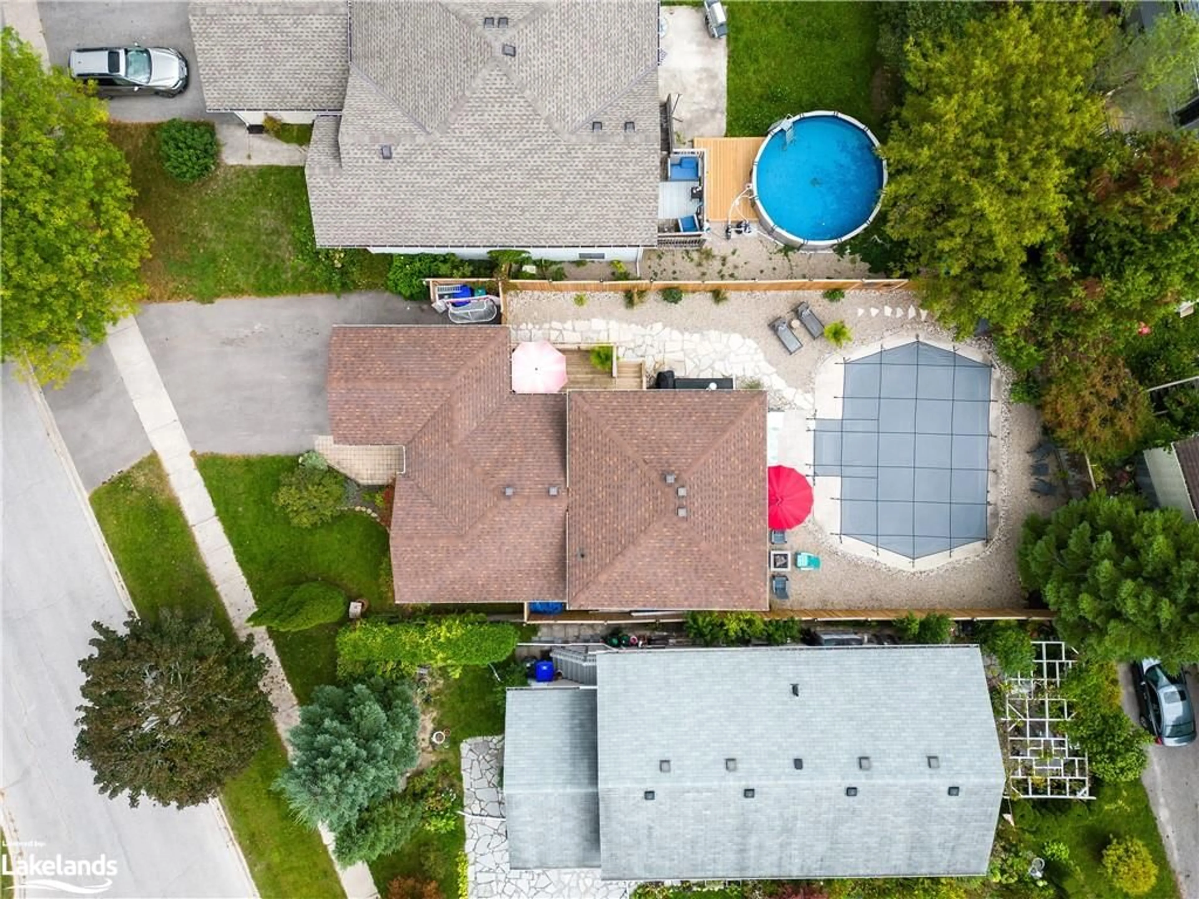 Frontside or backside of a home, the fenced backyard for 4 Dillon Dr, Collingwood Ontario L9Y 4S3