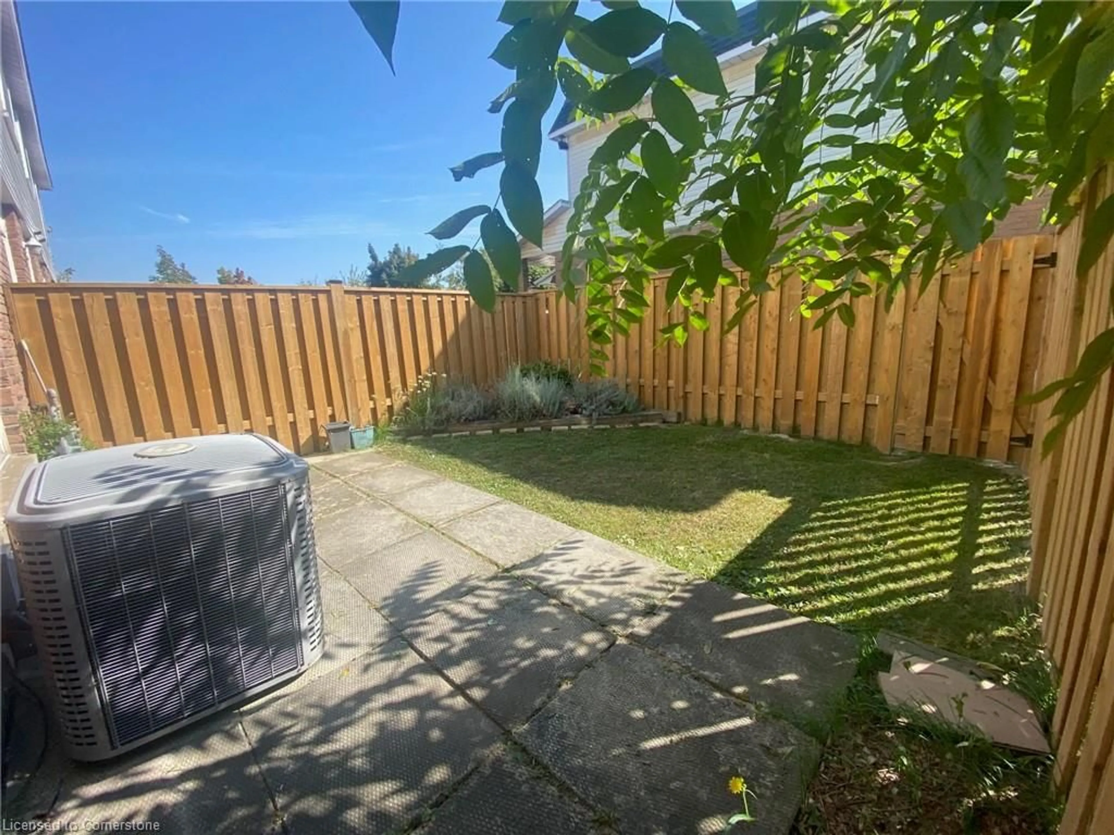 Patio, the fenced backyard for 19 Huntsville St, Hamilton Ontario L9A 4X1