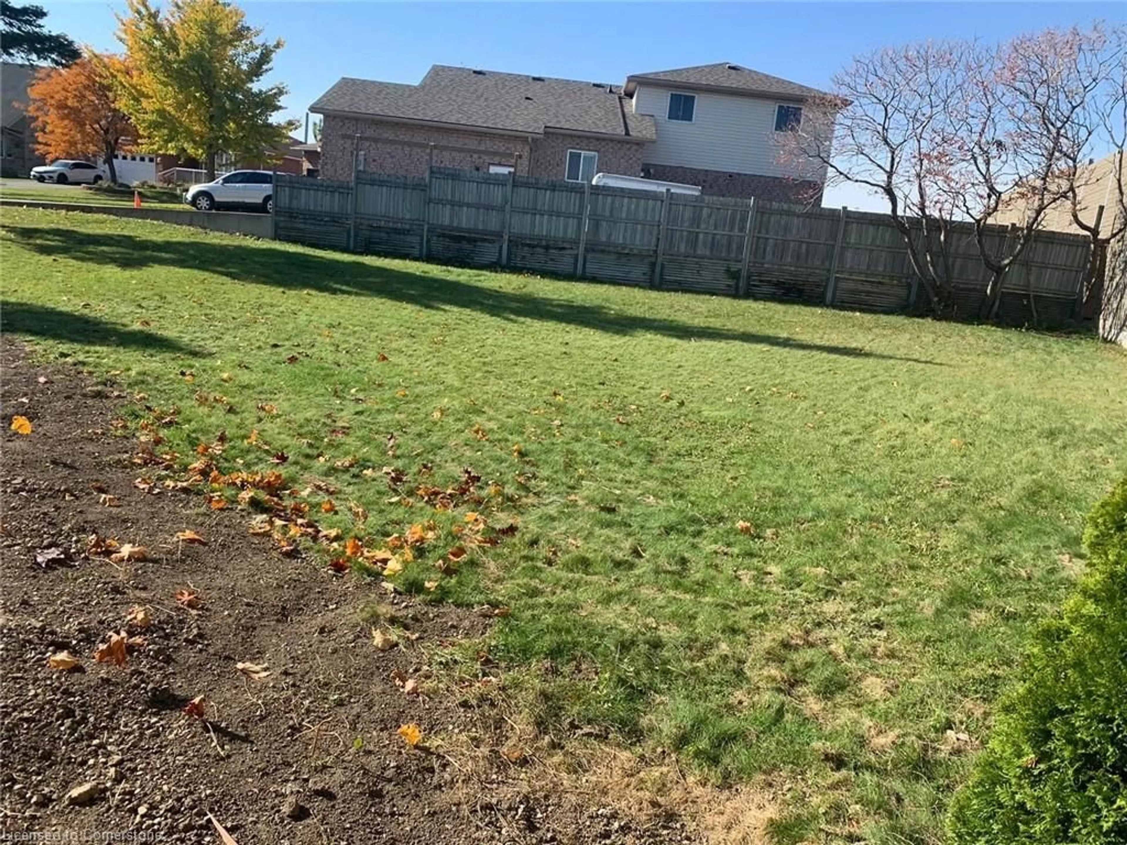 Frontside or backside of a home, the fenced backyard for 45 Wayne Ave, Cambridge Ontario N1R 0B8