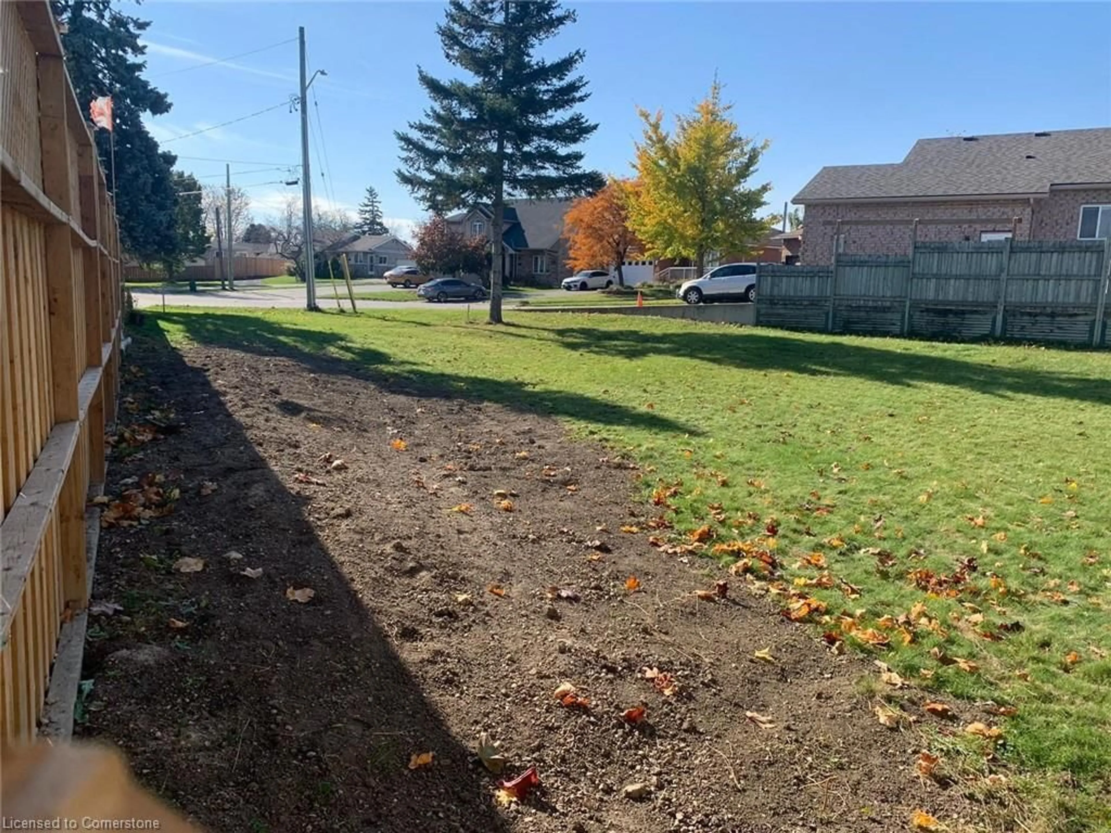 Frontside or backside of a home, the fenced backyard for 45 Wayne Ave, Cambridge Ontario N1R 0B8