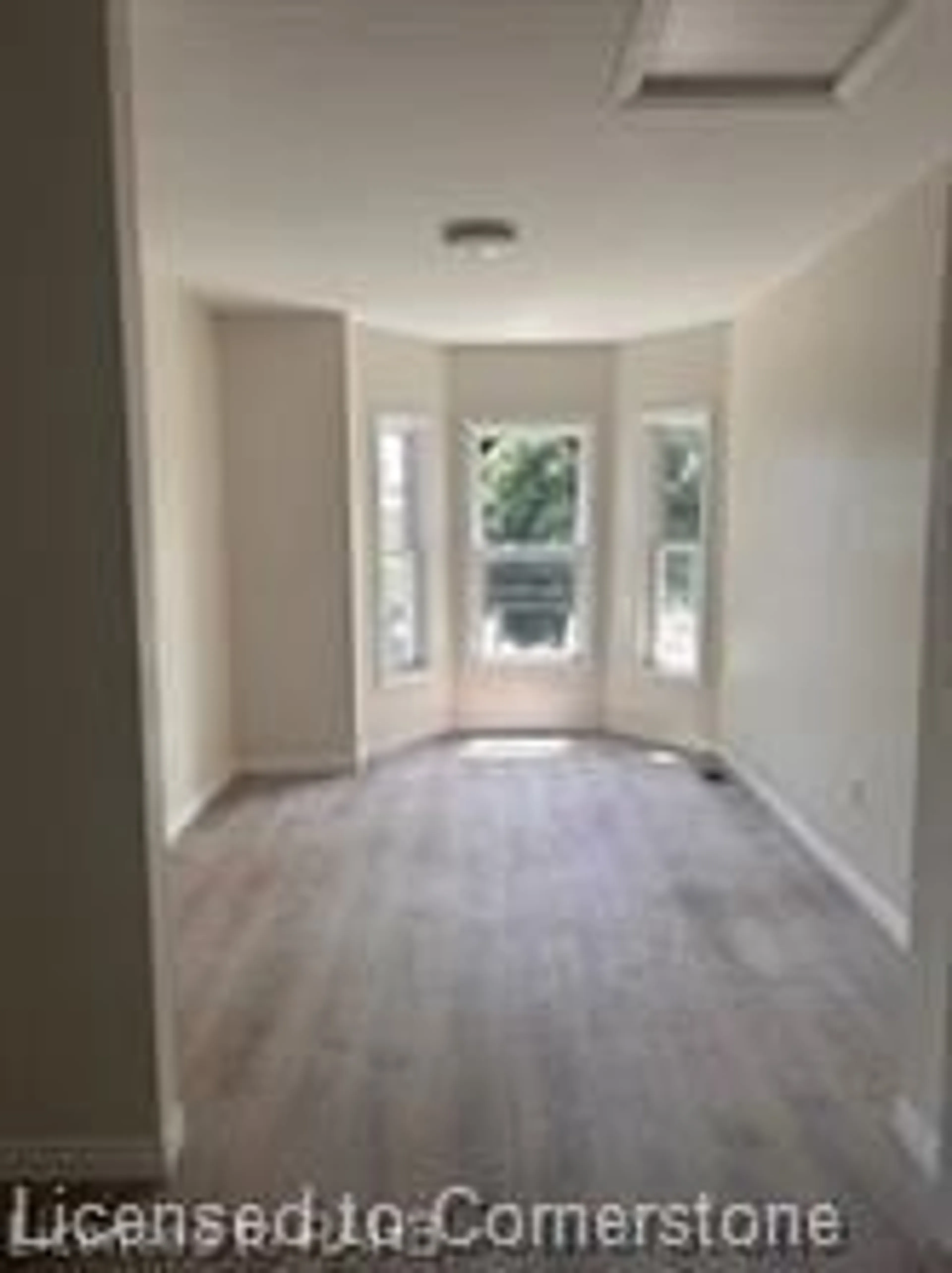 A pic of a room, wood floors for 33-35 Wood St, Hamilton Ontario L8L 3Y2